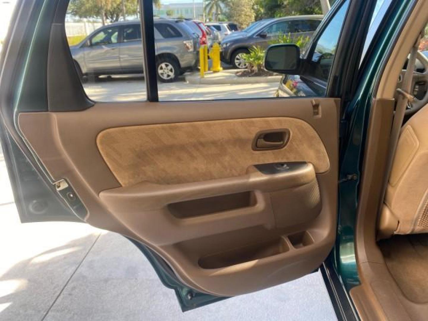 2002 Clover Green Pearl /Saddle Honda CR-V EX LOW MILES 34,271 1 OWNER 4WD (JHLRD78812C) with an 2.4L DOHC i-VTEC 16-Valve I4 Engine engine, Automatic transmission, located at 4701 North Dixie Hwy, Pompano Beach, FL, 33064, (954) 422-2889, 26.240938, -80.123474 - OUR WEBPAGE FLORIDACARS1.COM HAS OVER 100 PHOTOS AND FREE CARFAX LINK 2002 HONDA CR-V EX 4WD 1 OWNER VIN: JHLRD78812C081089 J H L R D 7 8 8 1 2 C 0 8 1 0 8 9 4 DOOR WAGON/SPORT UTILITY 2.4L I4 F DOHC GASOLINE 26 MPG ALL WHEEL DRIVE Features 4WD/AWD ABS Brakes Air Conditioning Alloy Wheels AM/FM Ster - Photo#75
