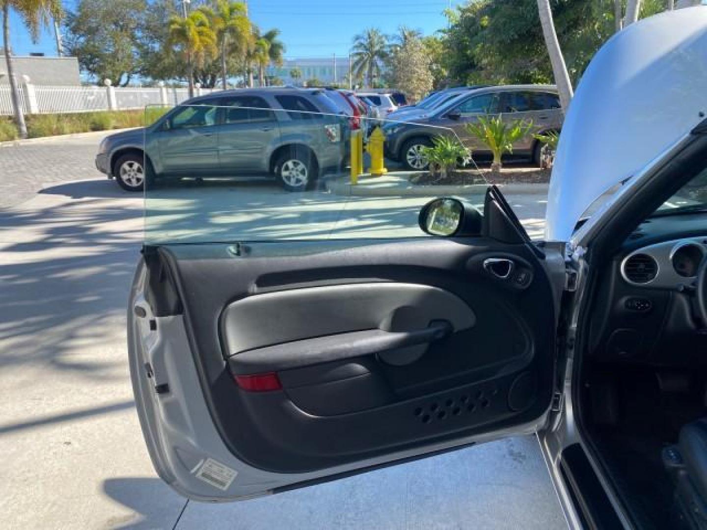 2005 Bright Silver Metallic /Dark Slate Gray Chrysler PT Cruiser GT LOW MILES 35,037 1 OWNER (3C3AY75S15T) with an 2.4L DOHC 16-Valve HO Turbo I4 Engine engine, Automatic transmission, located at 4701 North Dixie Hwy, Pompano Beach, FL, 33064, (954) 422-2889, 26.240938, -80.123474 - OUR WEBPAGE FLORIDACARS1.COM HAS OVER 100 PHOTOS AND FREE CARFAX LINK 2005 CHRYSLER PT CRUISER GT 1 OWNER VIN: 3C3AY75S15T362031 3 C 3 A Y 7 5 S 1 5 T 3 6 2 0 3 1 CONVERTIBLE 2.4L I4 F DOHC 16V GASOLINE 27 MPG FRONT WHEEL DRIVE Features ABS Brakes Air Conditioning Alloy Wheels AM/FM Stereo Automatic - Photo#9