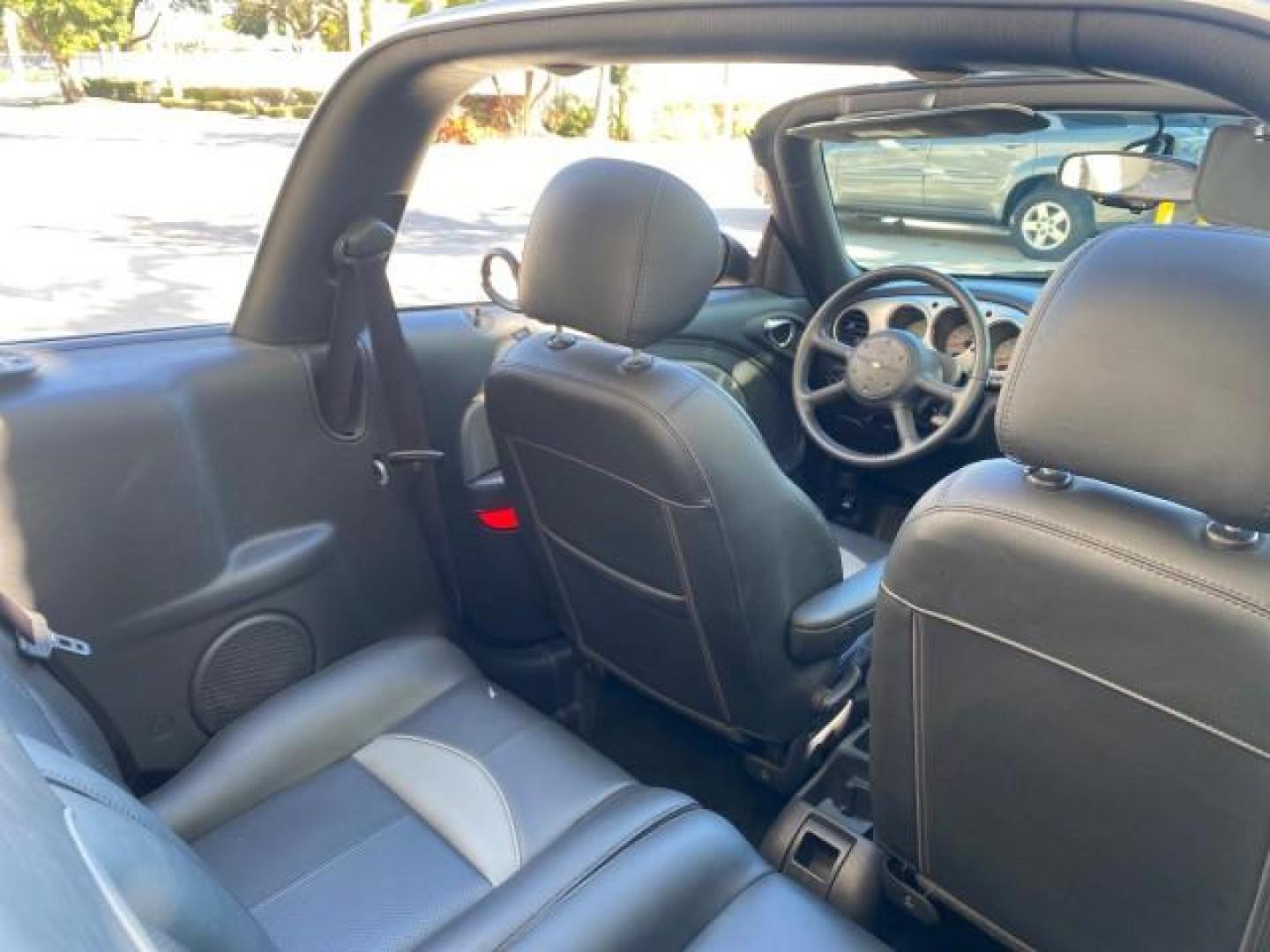 2005 Bright Silver Metallic /Dark Slate Gray Chrysler PT Cruiser GT LOW MILES 35,037 1 OWNER (3C3AY75S15T) with an 2.4L DOHC 16-Valve HO Turbo I4 Engine engine, Automatic transmission, located at 4701 North Dixie Hwy, Pompano Beach, FL, 33064, (954) 422-2889, 26.240938, -80.123474 - OUR WEBPAGE FLORIDACARS1.COM HAS OVER 100 PHOTOS AND FREE CARFAX LINK 2005 CHRYSLER PT CRUISER GT 1 OWNER VIN: 3C3AY75S15T362031 3 C 3 A Y 7 5 S 1 5 T 3 6 2 0 3 1 CONVERTIBLE 2.4L I4 F DOHC 16V GASOLINE 27 MPG FRONT WHEEL DRIVE Features ABS Brakes Air Conditioning Alloy Wheels AM/FM Stereo Automatic - Photo#52