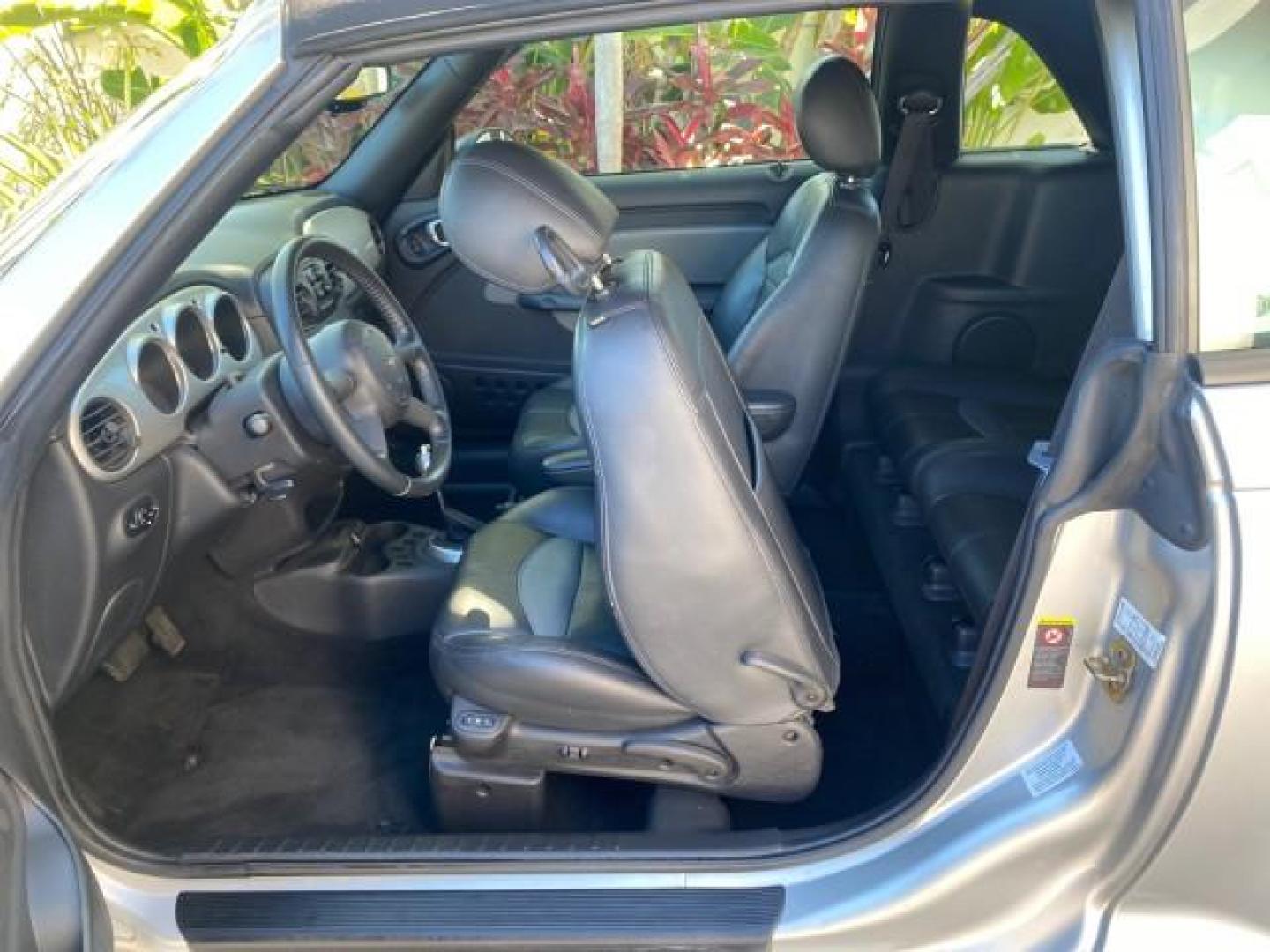 2005 Bright Silver Metallic /Dark Slate Gray Chrysler PT Cruiser GT LOW MILES 35,037 1 OWNER (3C3AY75S15T) with an 2.4L DOHC 16-Valve HO Turbo I4 Engine engine, Automatic transmission, located at 4701 North Dixie Hwy, Pompano Beach, FL, 33064, (954) 422-2889, 26.240938, -80.123474 - OUR WEBPAGE FLORIDACARS1.COM HAS OVER 100 PHOTOS AND FREE CARFAX LINK 2005 CHRYSLER PT CRUISER GT 1 OWNER VIN: 3C3AY75S15T362031 3 C 3 A Y 7 5 S 1 5 T 3 6 2 0 3 1 CONVERTIBLE 2.4L I4 F DOHC 16V GASOLINE 27 MPG FRONT WHEEL DRIVE Features ABS Brakes Air Conditioning Alloy Wheels AM/FM Stereo Automatic - Photo#85