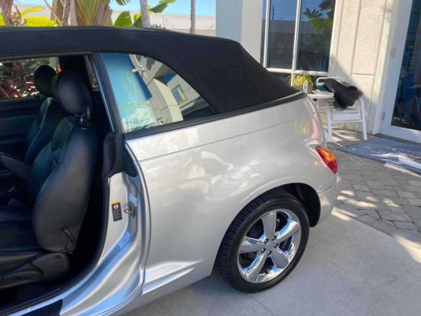 2005 Bright Silver Metallic /Dark Slate Gray Chrysler PT Cruiser GT LOW MILES 35,037 1 OWNER (3C3AY75S15T) with an 2.4L DOHC 16-Valve HO Turbo I4 Engine engine, Automatic transmission, located at 4701 North Dixie Hwy, Pompano Beach, FL, 33064, (954) 422-2889, 26.240938, -80.123474 - OUR WEBPAGE FLORIDACARS1.COM HAS OVER 100 PHOTOS AND FREE CARFAX LINK 2005 CHRYSLER PT CRUISER GT 1 OWNER VIN: 3C3AY75S15T362031 3 C 3 A Y 7 5 S 1 5 T 3 6 2 0 3 1 CONVERTIBLE 2.4L I4 F DOHC 16V GASOLINE 27 MPG FRONT WHEEL DRIVE Features ABS Brakes Air Conditioning Alloy Wheels AM/FM Stereo Automatic - Photo#90