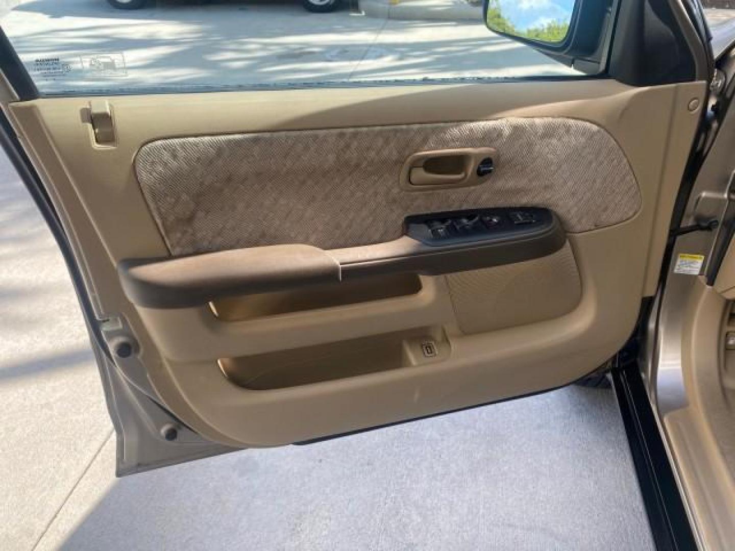 2005 Sahara Sand Metallic /Ivory Honda CR-V LX LOW MILES 52,177 SUV (SHSRD68595U) with an 2.4L DOHC MPFI 16-Valve i-VTEC I4 Engine engine, Automatic transmission, located at 4701 North Dixie Hwy, Pompano Beach, FL, 33064, (954) 422-2889, 26.240938, -80.123474 - OUR WEBPAGE FLORIDACARS1.COM HAS OVER 100 PHOTOS AND FREE CARFAX LINK 2005 HONDA CR-V LX VIN: SHSRD68595U306596 S H S R D 6 8 5 9 5 U 3 0 6 5 9 6 4 DOOR WAGON/SPORT UTILITY 2.4L I4 F DOHC GASOLINE 29 MPG FRONT WHEEL DRIVE Features ABS Brakes Air Conditioning AM/FM Stereo Automatic Transmission Casse - Photo#41