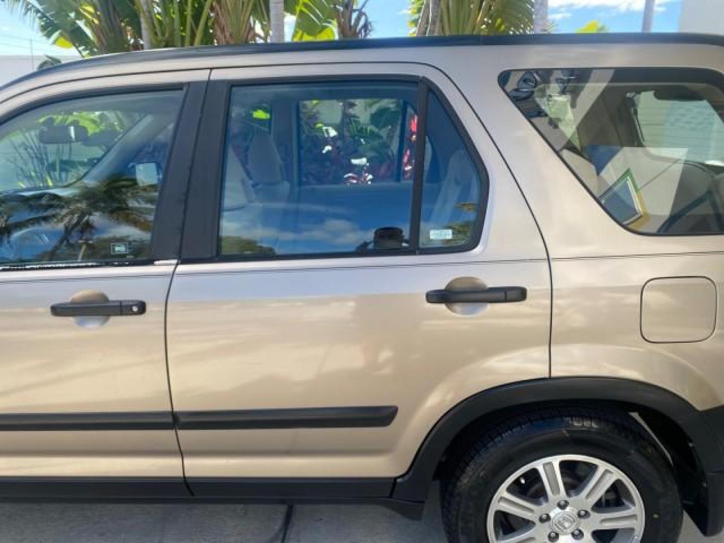 2005 Sahara Sand Metallic /Ivory Honda CR-V LX LOW MILES 52,177 SUV (SHSRD68595U) with an 2.4L DOHC MPFI 16-Valve i-VTEC I4 Engine engine, Automatic transmission, located at 4701 North Dixie Hwy, Pompano Beach, FL, 33064, (954) 422-2889, 26.240938, -80.123474 - OUR WEBPAGE FLORIDACARS1.COM HAS OVER 100 PHOTOS AND FREE CARFAX LINK 2005 HONDA CR-V LX VIN: SHSRD68595U306596 S H S R D 6 8 5 9 5 U 3 0 6 5 9 6 4 DOOR WAGON/SPORT UTILITY 2.4L I4 F DOHC GASOLINE 29 MPG FRONT WHEEL DRIVE Features ABS Brakes Air Conditioning AM/FM Stereo Automatic Transmission Casse - Photo#69