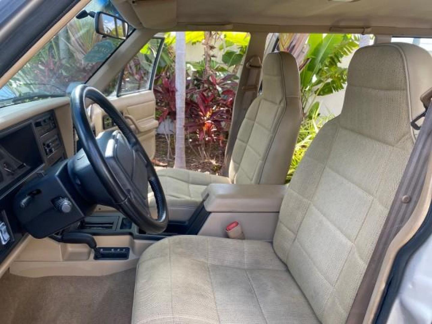 1996 Stone White (CC) /Dark Sand Jeep Cherokee Sport FL LOW MILES 77,388 4WD 4.0 6 CYL (1J4FJ68S2TL) with an 4.0L MPI I6 Engine engine, Automatic transmission, located at 4701 North Dixie Hwy, Pompano Beach, FL, 33064, (954) 422-2889, 26.240938, -80.123474 - OUR WEBPAGE FLORIDACARS1.COM HAS OVER 100 PHOTOS AND FREE CARFAX LINK 1996 JEEP CHEROKEE SPORT 4.0 6 CYL 4WD FL TITLE LOW MILES 77,388 VIN: 1J4FJ68S2TL171877 1 J 4 F J 6 8 S 2 T L 1 7 1 8 7 7 4 DOOR WAGON/SPORT UTILITY 4.0L I6 F GASOLINE REAR WHEEL DRIVE W/ 4X4 Top Features Cloth Seats Basic Feature- Photo#10