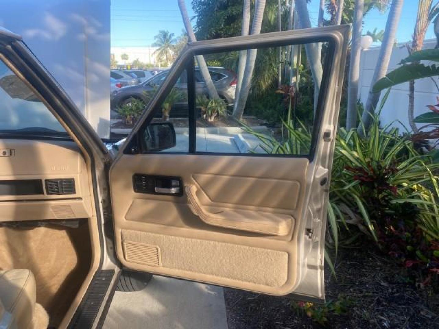 1996 Stone White (CC) /Dark Sand Jeep Cherokee Sport FL LOW MILES 77,388 4WD 4.0 6 CYL (1J4FJ68S2TL) with an 4.0L MPI I6 Engine engine, Automatic transmission, located at 4701 North Dixie Hwy, Pompano Beach, FL, 33064, (954) 422-2889, 26.240938, -80.123474 - OUR WEBPAGE FLORIDACARS1.COM HAS OVER 100 PHOTOS AND FREE CARFAX LINK 1996 JEEP CHEROKEE SPORT 4.0 6 CYL 4WD FL TITLE LOW MILES 77,388 VIN: 1J4FJ68S2TL171877 1 J 4 F J 6 8 S 2 T L 1 7 1 8 7 7 4 DOOR WAGON/SPORT UTILITY 4.0L I6 F GASOLINE REAR WHEEL DRIVE W/ 4X4 Top Features Cloth Seats Basic Feature- Photo#11