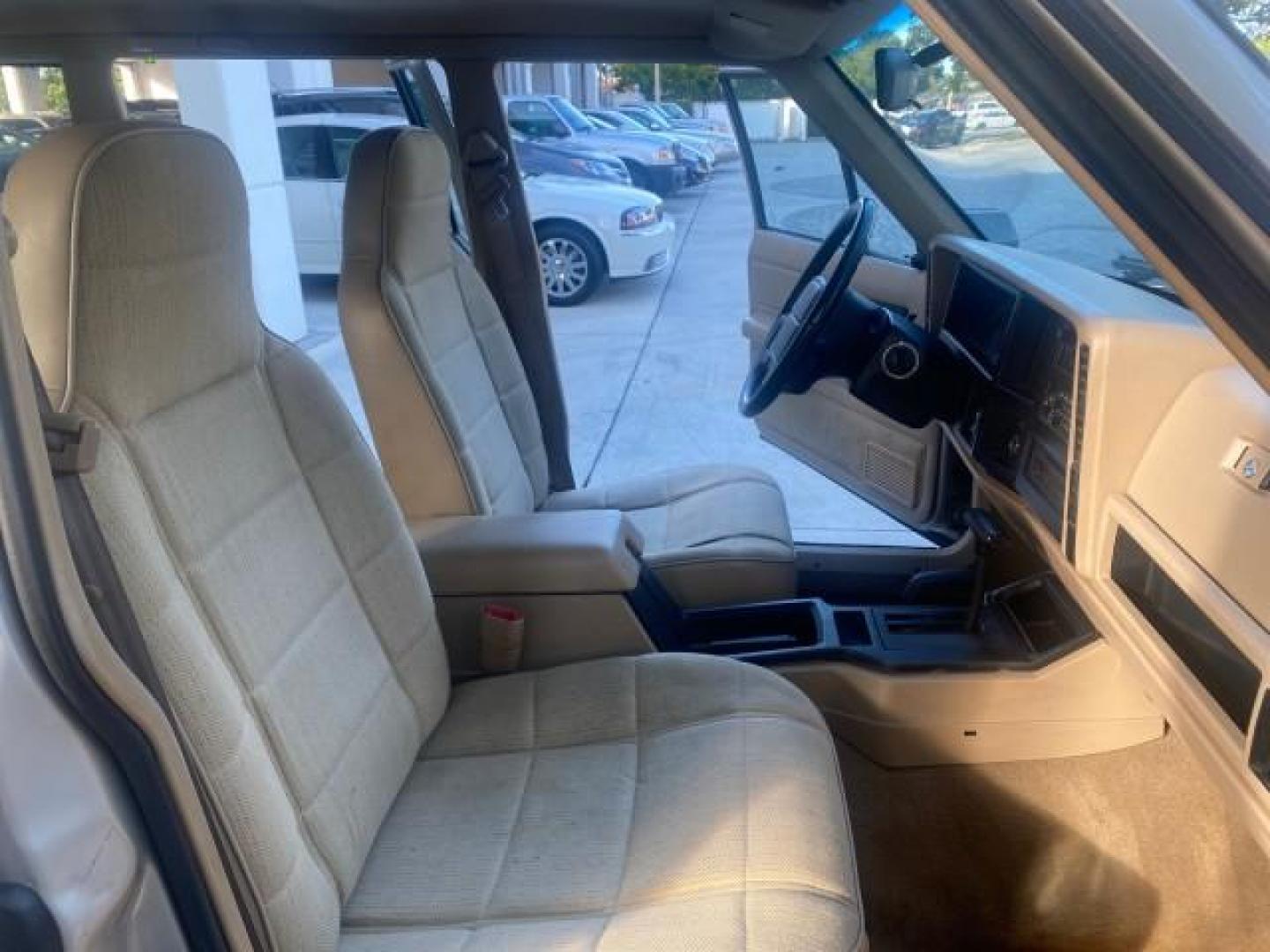 1996 Stone White (CC) /Dark Sand Jeep Cherokee Sport FL LOW MILES 77,388 4WD 4.0 6 CYL (1J4FJ68S2TL) with an 4.0L MPI I6 Engine engine, Automatic transmission, located at 4701 North Dixie Hwy, Pompano Beach, FL, 33064, (954) 422-2889, 26.240938, -80.123474 - OUR WEBPAGE FLORIDACARS1.COM HAS OVER 100 PHOTOS AND FREE CARFAX LINK 1996 JEEP CHEROKEE SPORT 4.0 6 CYL 4WD FL TITLE LOW MILES 77,388 VIN: 1J4FJ68S2TL171877 1 J 4 F J 6 8 S 2 T L 1 7 1 8 7 7 4 DOOR WAGON/SPORT UTILITY 4.0L I6 F GASOLINE REAR WHEEL DRIVE W/ 4X4 Top Features Cloth Seats Basic Feature- Photo#12