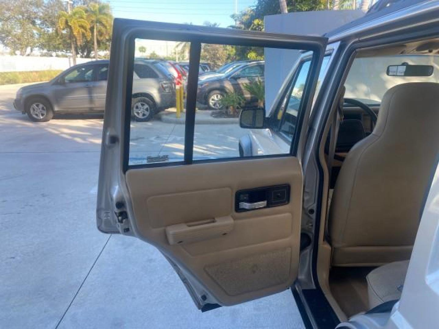 1996 Stone White (CC) /Dark Sand Jeep Cherokee Sport FL LOW MILES 77,388 4WD 4.0 6 CYL (1J4FJ68S2TL) with an 4.0L MPI I6 Engine engine, Automatic transmission, located at 4701 North Dixie Hwy, Pompano Beach, FL, 33064, (954) 422-2889, 26.240938, -80.123474 - OUR WEBPAGE FLORIDACARS1.COM HAS OVER 100 PHOTOS AND FREE CARFAX LINK 1996 JEEP CHEROKEE SPORT 4.0 6 CYL 4WD FL TITLE LOW MILES 77,388 VIN: 1J4FJ68S2TL171877 1 J 4 F J 6 8 S 2 T L 1 7 1 8 7 7 4 DOOR WAGON/SPORT UTILITY 4.0L I6 F GASOLINE REAR WHEEL DRIVE W/ 4X4 Top Features Cloth Seats Basic Feature- Photo#13