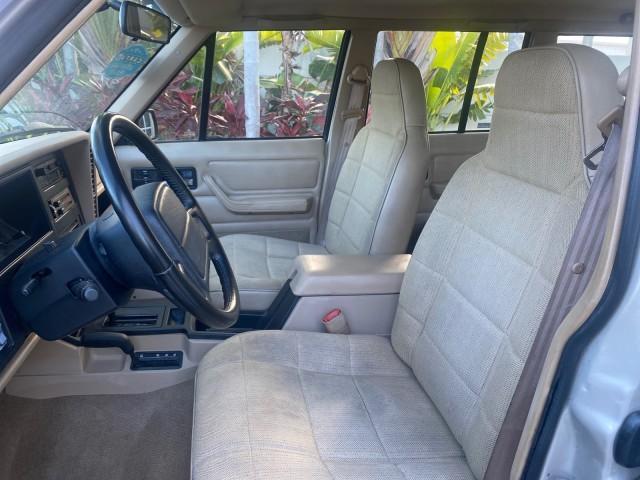 1996 Bright Jade (PC) /Dark Sand Jeep Cherokee Sport FL LOW MILES 77,388 4WD 4.0 6 CYL (1J4FJ68S2TL) with an 4.0L MPI I6 Engine engine, Automatic transmission, located at 4701 North Dixie Hwy, Pompano Beach, FL, 33064, (954) 422-2889, 26.240938, -80.123474 - OUR WEBPAGE FLORIDACARS1.COM HAS OVER 100 PHOTOS AND FREE CARFAX LINK 1996 JEEP CHEROKEE SPORT 4.0 6 CYL 4WD FL TITLE LOW MILES 77,388 VIN: 1J4FJ68S2TL171877 1 J 4 F J 6 8 S 2 T L 1 7 1 8 7 7 4 DOOR WAGON/SPORT UTILITY 4.0L I6 F GASOLINE REAR WHEEL DRIVE W/ 4X4 Top Features Cloth Seats Basic Feature - Photo#41