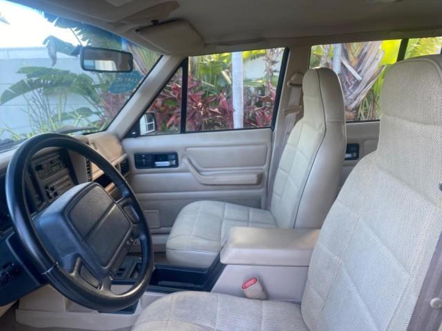 1996 Stone White (CC) /Dark Sand Jeep Cherokee Sport FL LOW MILES 77,388 4WD 4.0 6 CYL (1J4FJ68S2TL) with an 4.0L MPI I6 Engine engine, Automatic transmission, located at 4701 North Dixie Hwy, Pompano Beach, FL, 33064, (954) 422-2889, 26.240938, -80.123474 - OUR WEBPAGE FLORIDACARS1.COM HAS OVER 100 PHOTOS AND FREE CARFAX LINK 1996 JEEP CHEROKEE SPORT 4.0 6 CYL 4WD FL TITLE LOW MILES 77,388 VIN: 1J4FJ68S2TL171877 1 J 4 F J 6 8 S 2 T L 1 7 1 8 7 7 4 DOOR WAGON/SPORT UTILITY 4.0L I6 F GASOLINE REAR WHEEL DRIVE W/ 4X4 Top Features Cloth Seats Basic Feature- Photo#42