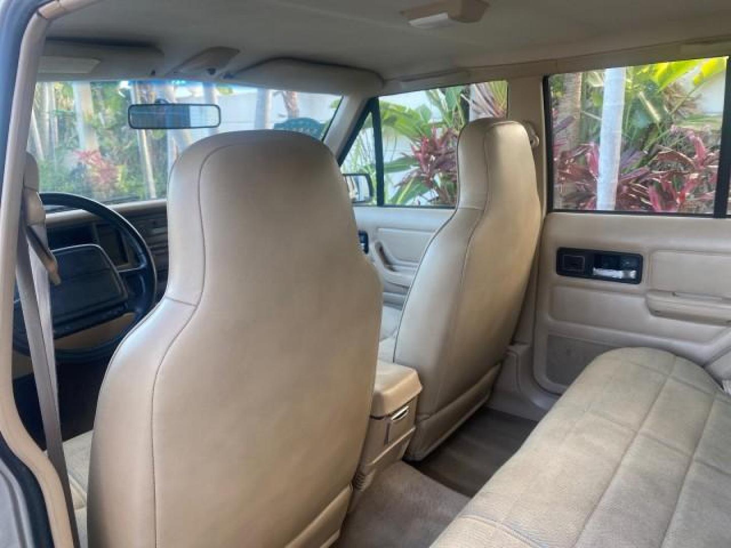 1996 Stone White (CC) /Dark Sand Jeep Cherokee Sport FL LOW MILES 77,388 4WD 4.0 6 CYL (1J4FJ68S2TL) with an 4.0L MPI I6 Engine engine, Automatic transmission, located at 4701 North Dixie Hwy, Pompano Beach, FL, 33064, (954) 422-2889, 26.240938, -80.123474 - OUR WEBPAGE FLORIDACARS1.COM HAS OVER 100 PHOTOS AND FREE CARFAX LINK 1996 JEEP CHEROKEE SPORT 4.0 6 CYL 4WD FL TITLE LOW MILES 77,388 VIN: 1J4FJ68S2TL171877 1 J 4 F J 6 8 S 2 T L 1 7 1 8 7 7 4 DOOR WAGON/SPORT UTILITY 4.0L I6 F GASOLINE REAR WHEEL DRIVE W/ 4X4 Top Features Cloth Seats Basic Feature- Photo#75