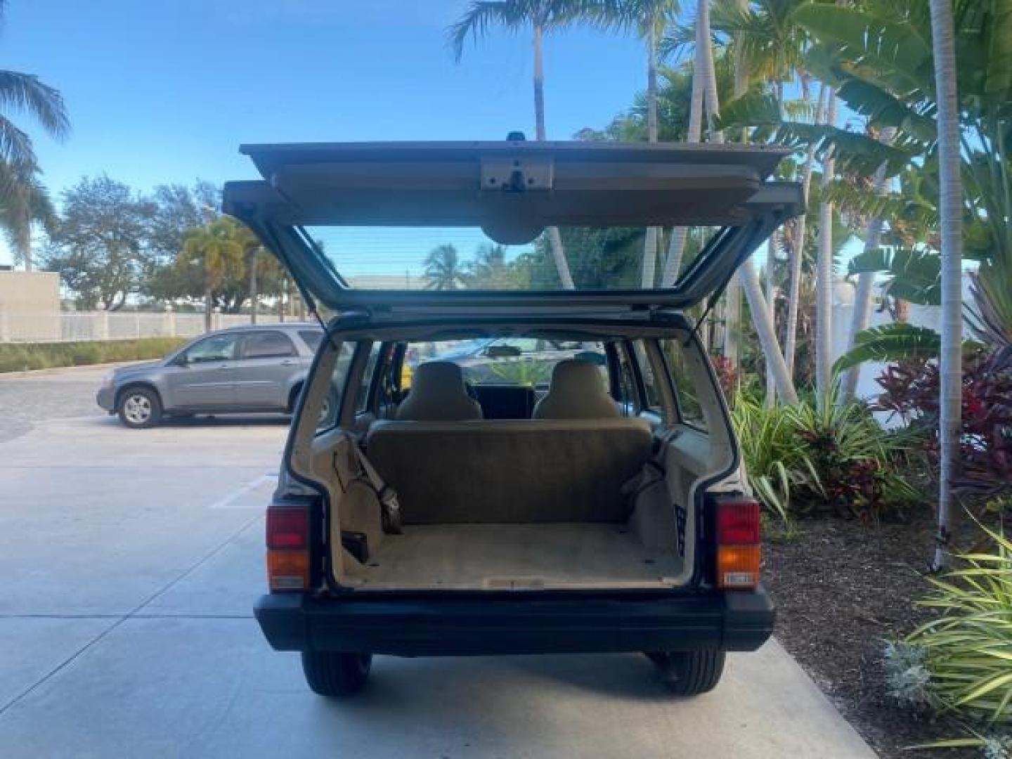 1996 Stone White (CC) /Dark Sand Jeep Cherokee Sport FL LOW MILES 77,388 4WD 4.0 6 CYL (1J4FJ68S2TL) with an 4.0L MPI I6 Engine engine, Automatic transmission, located at 4701 North Dixie Hwy, Pompano Beach, FL, 33064, (954) 422-2889, 26.240938, -80.123474 - OUR WEBPAGE FLORIDACARS1.COM HAS OVER 100 PHOTOS AND FREE CARFAX LINK 1996 JEEP CHEROKEE SPORT 4.0 6 CYL 4WD FL TITLE LOW MILES 77,388 VIN: 1J4FJ68S2TL171877 1 J 4 F J 6 8 S 2 T L 1 7 1 8 7 7 4 DOOR WAGON/SPORT UTILITY 4.0L I6 F GASOLINE REAR WHEEL DRIVE W/ 4X4 Top Features Cloth Seats Basic Feature- Photo#86