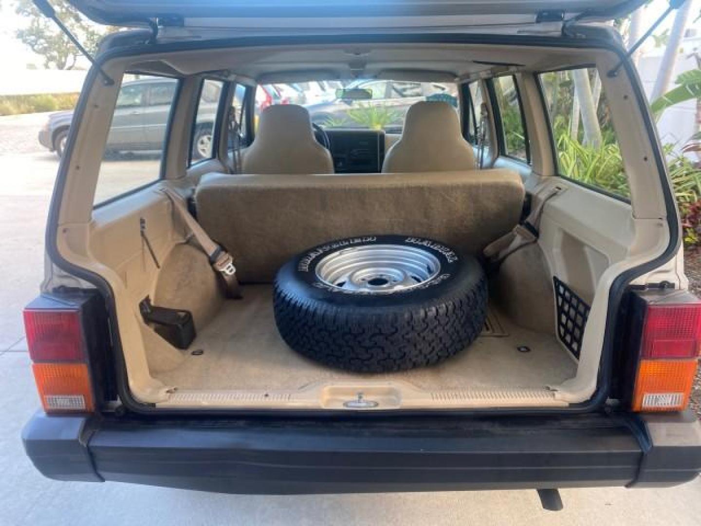 1996 Stone White (CC) /Dark Sand Jeep Cherokee Sport FL LOW MILES 77,388 4WD 4.0 6 CYL (1J4FJ68S2TL) with an 4.0L MPI I6 Engine engine, Automatic transmission, located at 4701 North Dixie Hwy, Pompano Beach, FL, 33064, (954) 422-2889, 26.240938, -80.123474 - OUR WEBPAGE FLORIDACARS1.COM HAS OVER 100 PHOTOS AND FREE CARFAX LINK 1996 JEEP CHEROKEE SPORT 4.0 6 CYL 4WD FL TITLE LOW MILES 77,388 VIN: 1J4FJ68S2TL171877 1 J 4 F J 6 8 S 2 T L 1 7 1 8 7 7 4 DOOR WAGON/SPORT UTILITY 4.0L I6 F GASOLINE REAR WHEEL DRIVE W/ 4X4 Top Features Cloth Seats Basic Feature- Photo#92