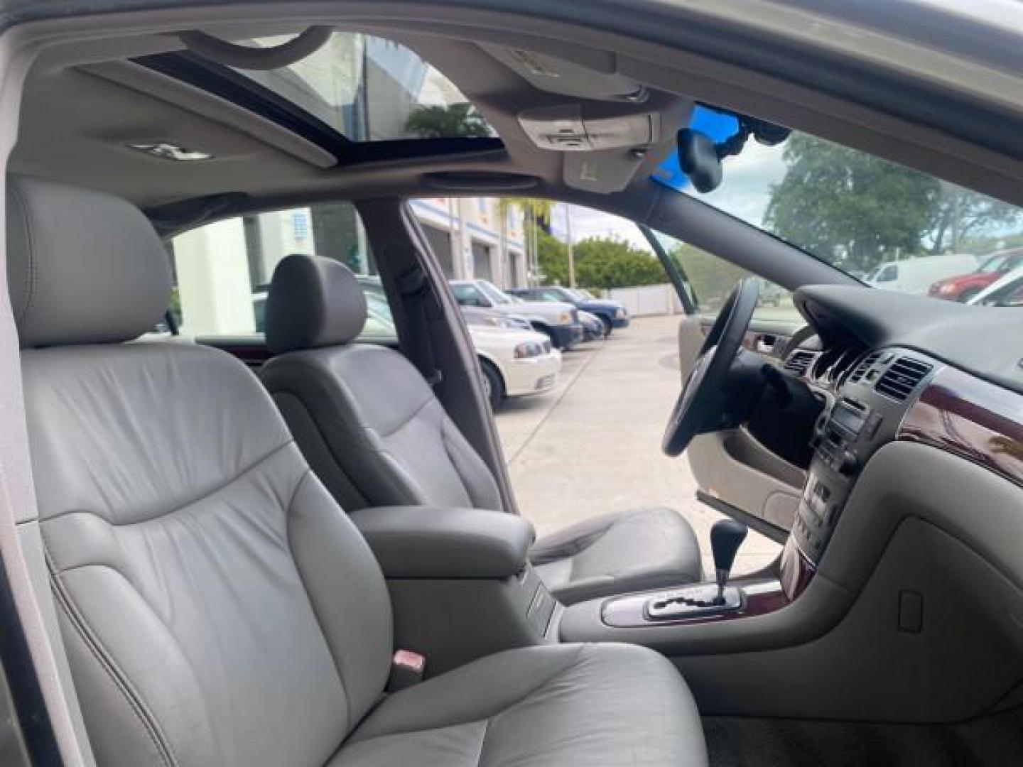 2004 Millennium Silver Metallic /Light Charcoal Lexus ES 330 LOW MILES 74,701 SUNROOF (JTHBA30G745) with an 3.3L DOHC EFI 24-Valve V6 Engine engine, Automatic transmission, located at 4701 North Dixie Hwy, Pompano Beach, FL, 33064, (954) 422-2889, 26.240938, -80.123474 - OUR WEBPAGE FLORIDACARS1.COM HAS OVER 100 PHOTOS AND FREE CARFAX LINK 2004 LEXUS ES 330 ORIGINAL PRICE NEW $32,384 VIN: JTHBA30G745034416 J T H B A 3 0 G 7 4 5 0 3 4 4 1 6 SEDAN 4 DR 3.3L V6 F 24V GASOLINE 29 MPG FRONT WHEEL DRIVE Features ABS Brakes Air Conditioning Alloy Wheels AM/FM Stereo Automa - Photo#12