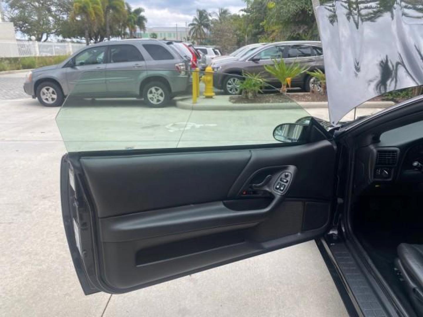 2002 Black /Ebony Chevrolet Camaro Z28 CONV 6 SPD LOW MILES 29,016 (2G1FP32G622) with an 5.7L SFI V8 Engine engine, Manual transmission, located at 4701 North Dixie Hwy, Pompano Beach, FL, 33064, (954) 422-2889, 26.240938, -80.123474 - OUR WEBPAGE FLORIDACARS1.COM HAS OVER 100 PHOTOS AND FREE CARFAX LINK 2002 CHEVROLET CAMARO Z28 6 SPEED ALL ORIGINAL PAINT VERY LOW MILES VIN: 2G1FP32G622129985 2 G 1 F P 3 2 G 6 2 2 1 2 9 9 8 5 CONVERTIBLE 5.7L V8 F OHV GASOLINE 25 MPG REAR WHEEL DRIVE Features ABS Brakes Air Conditioning Alloy Whe - Photo#9