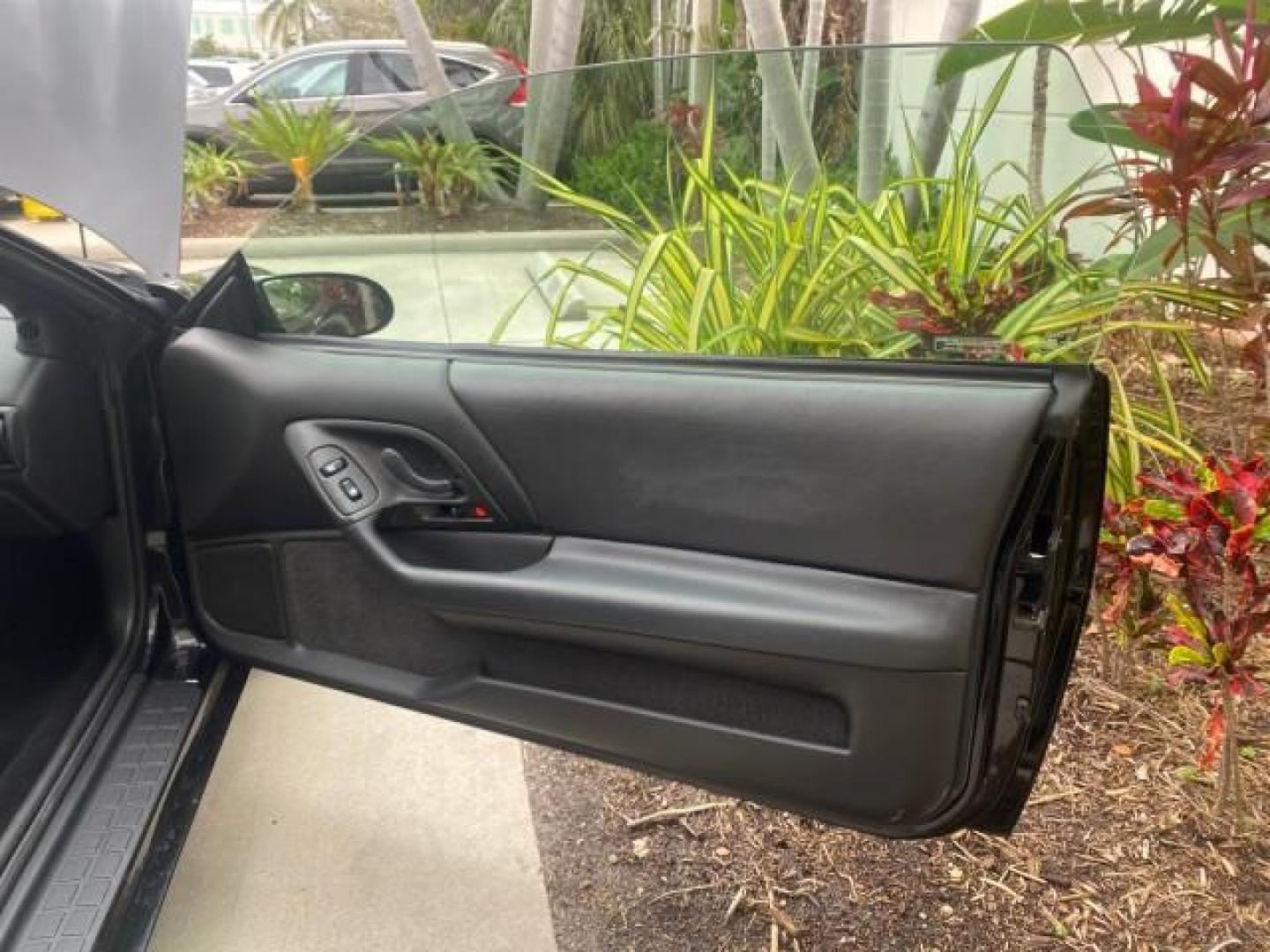 2002 Black /Ebony Chevrolet Camaro Z28 CONV 6 SPD LOW MILES 29,016 (2G1FP32G622) with an 5.7L SFI V8 Engine engine, Manual transmission, located at 4701 North Dixie Hwy, Pompano Beach, FL, 33064, (954) 422-2889, 26.240938, -80.123474 - OUR WEBPAGE FLORIDACARS1.COM HAS OVER 100 PHOTOS AND FREE CARFAX LINK 2002 CHEVROLET CAMARO Z28 6 SPEED ALL ORIGINAL PAINT VERY LOW MILES VIN: 2G1FP32G622129985 2 G 1 F P 3 2 G 6 2 2 1 2 9 9 8 5 CONVERTIBLE 5.7L V8 F OHV GASOLINE 25 MPG REAR WHEEL DRIVE Features ABS Brakes Air Conditioning Alloy Whe - Photo#11