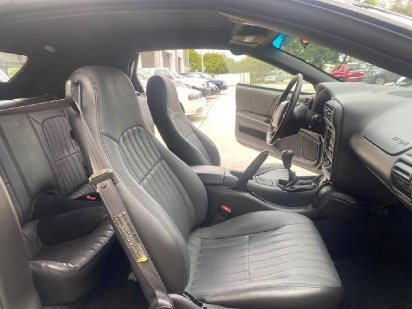 2002 Black /Ebony Chevrolet Camaro Z28 CONV 6 SPD LOW MILES 29,016 (2G1FP32G622) with an 5.7L SFI V8 Engine engine, Manual transmission, located at 4701 North Dixie Hwy, Pompano Beach, FL, 33064, (954) 422-2889, 26.240938, -80.123474 - OUR WEBPAGE FLORIDACARS1.COM HAS OVER 100 PHOTOS AND FREE CARFAX LINK 2002 CHEVROLET CAMARO Z28 6 SPEED ALL ORIGINAL PAINT VERY LOW MILES VIN: 2G1FP32G622129985 2 G 1 F P 3 2 G 6 2 2 1 2 9 9 8 5 CONVERTIBLE 5.7L V8 F OHV GASOLINE 25 MPG REAR WHEEL DRIVE Features ABS Brakes Air Conditioning Alloy Whe - Photo#12