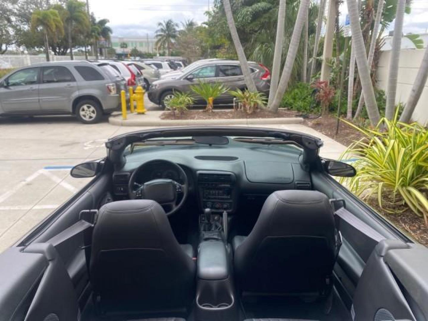 2002 Black /Ebony Chevrolet Camaro Z28 CONV 6 SPD LOW MILES 29,016 (2G1FP32G622) with an 5.7L SFI V8 Engine engine, Manual transmission, located at 4701 North Dixie Hwy, Pompano Beach, FL, 33064, (954) 422-2889, 26.240938, -80.123474 - OUR WEBPAGE FLORIDACARS1.COM HAS OVER 100 PHOTOS AND FREE CARFAX LINK 2002 CHEVROLET CAMARO Z28 6 SPEED ALL ORIGINAL PAINT VERY LOW MILES VIN: 2G1FP32G622129985 2 G 1 F P 3 2 G 6 2 2 1 2 9 9 8 5 CONVERTIBLE 5.7L V8 F OHV GASOLINE 25 MPG REAR WHEEL DRIVE Features ABS Brakes Air Conditioning Alloy Whe - Photo#46