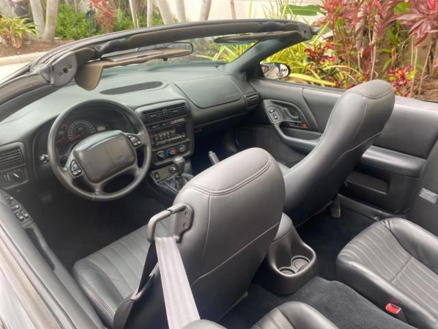 2002 Black /Ebony Chevrolet Camaro Z28 CONV 6 SPD LOW MILES 29,016 (2G1FP32G622) with an 5.7L SFI V8 Engine engine, Manual transmission, located at 4701 North Dixie Hwy, Pompano Beach, FL, 33064, (954) 422-2889, 26.240938, -80.123474 - OUR WEBPAGE FLORIDACARS1.COM HAS OVER 100 PHOTOS AND FREE CARFAX LINK 2002 CHEVROLET CAMARO Z28 6 SPEED ALL ORIGINAL PAINT VERY LOW MILES VIN: 2G1FP32G622129985 2 G 1 F P 3 2 G 6 2 2 1 2 9 9 8 5 CONVERTIBLE 5.7L V8 F OHV GASOLINE 25 MPG REAR WHEEL DRIVE Features ABS Brakes Air Conditioning Alloy Whe - Photo#48