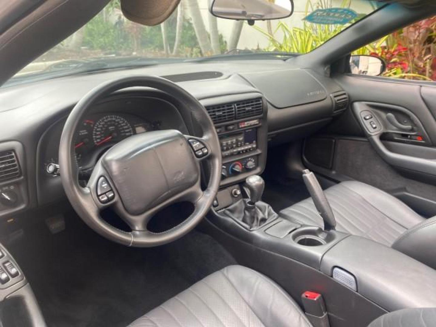 2002 Black /Ebony Chevrolet Camaro Z28 CONV 6 SPD LOW MILES 29,016 (2G1FP32G622) with an 5.7L SFI V8 Engine engine, Manual transmission, located at 4701 North Dixie Hwy, Pompano Beach, FL, 33064, (954) 422-2889, 26.240938, -80.123474 - OUR WEBPAGE FLORIDACARS1.COM HAS OVER 100 PHOTOS AND FREE CARFAX LINK 2002 CHEVROLET CAMARO Z28 6 SPEED ALL ORIGINAL PAINT VERY LOW MILES VIN: 2G1FP32G622129985 2 G 1 F P 3 2 G 6 2 2 1 2 9 9 8 5 CONVERTIBLE 5.7L V8 F OHV GASOLINE 25 MPG REAR WHEEL DRIVE Features ABS Brakes Air Conditioning Alloy Whe - Photo#49