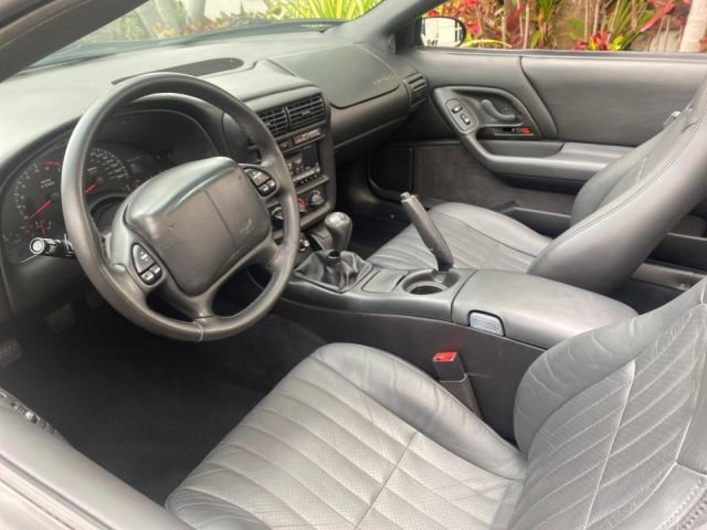 2002 Black /Ebony Chevrolet Camaro Z28 CONV 6 SPD LOW MILES 29,016 (2G1FP32G622) with an 5.7L SFI V8 Engine engine, Manual transmission, located at 4701 North Dixie Hwy, Pompano Beach, FL, 33064, (954) 422-2889, 26.240938, -80.123474 - OUR WEBPAGE FLORIDACARS1.COM HAS OVER 100 PHOTOS AND FREE CARFAX LINK 2002 CHEVROLET CAMARO Z28 6 SPEED ALL ORIGINAL PAINT VERY LOW MILES VIN: 2G1FP32G622129985 2 G 1 F P 3 2 G 6 2 2 1 2 9 9 8 5 CONVERTIBLE 5.7L V8 F OHV GASOLINE 25 MPG REAR WHEEL DRIVE Features ABS Brakes Air Conditioning Alloy Whe - Photo#50