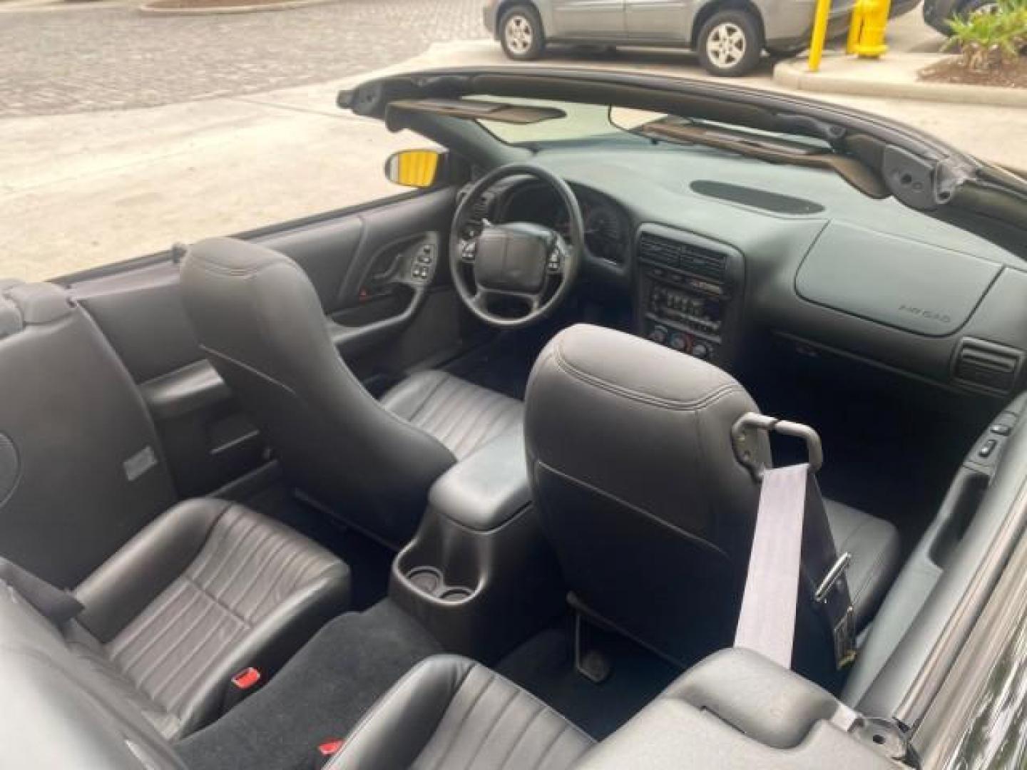 2002 Black /Ebony Chevrolet Camaro Z28 CONV 6 SPD LOW MILES 29,016 (2G1FP32G622) with an 5.7L SFI V8 Engine engine, Manual transmission, located at 4701 North Dixie Hwy, Pompano Beach, FL, 33064, (954) 422-2889, 26.240938, -80.123474 - OUR WEBPAGE FLORIDACARS1.COM HAS OVER 100 PHOTOS AND FREE CARFAX LINK 2002 CHEVROLET CAMARO Z28 6 SPEED ALL ORIGINAL PAINT VERY LOW MILES VIN: 2G1FP32G622129985 2 G 1 F P 3 2 G 6 2 2 1 2 9 9 8 5 CONVERTIBLE 5.7L V8 F OHV GASOLINE 25 MPG REAR WHEEL DRIVE Features ABS Brakes Air Conditioning Alloy Whe - Photo#54