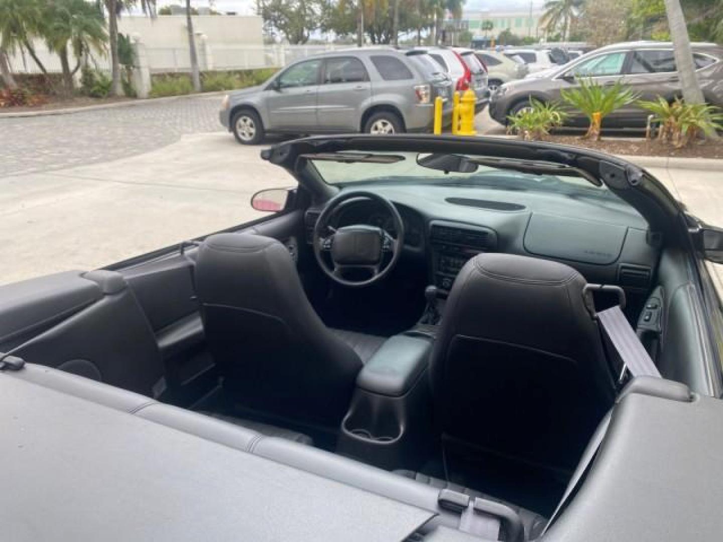 2002 Black /Ebony Chevrolet Camaro Z28 CONV 6 SPD LOW MILES 29,016 (2G1FP32G622) with an 5.7L SFI V8 Engine engine, Manual transmission, located at 4701 North Dixie Hwy, Pompano Beach, FL, 33064, (954) 422-2889, 26.240938, -80.123474 - OUR WEBPAGE FLORIDACARS1.COM HAS OVER 100 PHOTOS AND FREE CARFAX LINK 2002 CHEVROLET CAMARO Z28 6 SPEED ALL ORIGINAL PAINT VERY LOW MILES VIN: 2G1FP32G622129985 2 G 1 F P 3 2 G 6 2 2 1 2 9 9 8 5 CONVERTIBLE 5.7L V8 F OHV GASOLINE 25 MPG REAR WHEEL DRIVE Features ABS Brakes Air Conditioning Alloy Whe - Photo#55