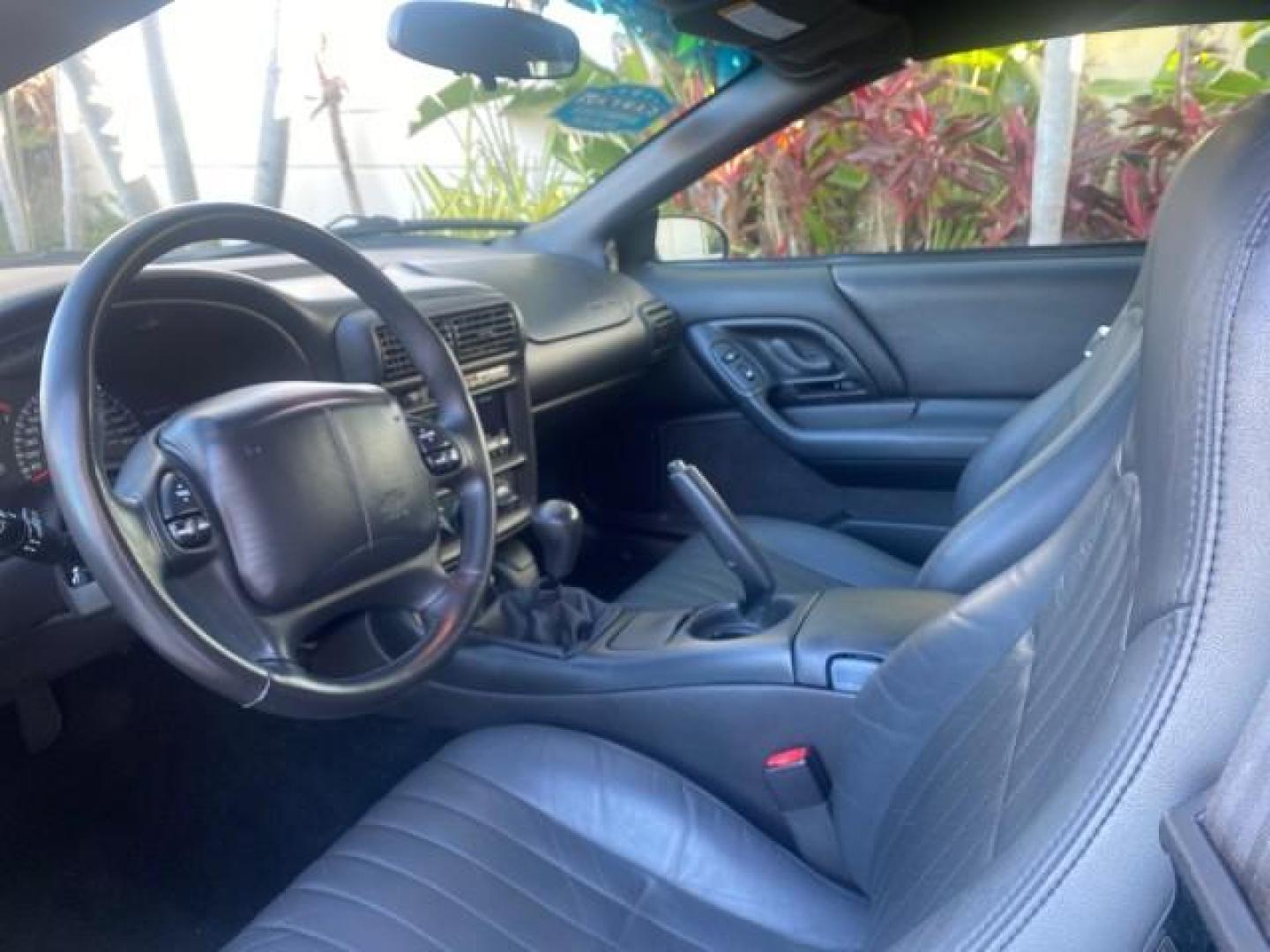 2002 Black /Ebony Chevrolet Camaro Z28 CONV 6 SPD LOW MILES 29,016 (2G1FP32G622) with an 5.7L SFI V8 Engine engine, Manual transmission, located at 4701 North Dixie Hwy, Pompano Beach, FL, 33064, (954) 422-2889, 26.240938, -80.123474 - OUR WEBPAGE FLORIDACARS1.COM HAS OVER 100 PHOTOS AND FREE CARFAX LINK 2002 CHEVROLET CAMARO Z28 6 SPEED ALL ORIGINAL PAINT VERY LOW MILES VIN: 2G1FP32G622129985 2 G 1 F P 3 2 G 6 2 2 1 2 9 9 8 5 CONVERTIBLE 5.7L V8 F OHV GASOLINE 25 MPG REAR WHEEL DRIVE Features ABS Brakes Air Conditioning Alloy Whe - Photo#65