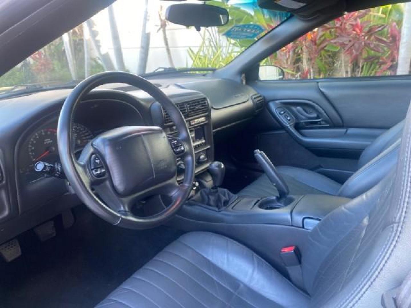 2002 Black /Ebony Chevrolet Camaro Z28 CONV 6 SPD LOW MILES 29,016 (2G1FP32G622) with an 5.7L SFI V8 Engine engine, Manual transmission, located at 4701 North Dixie Hwy, Pompano Beach, FL, 33064, (954) 422-2889, 26.240938, -80.123474 - OUR WEBPAGE FLORIDACARS1.COM HAS OVER 100 PHOTOS AND FREE CARFAX LINK 2002 CHEVROLET CAMARO Z28 6 SPEED ALL ORIGINAL PAINT VERY LOW MILES VIN: 2G1FP32G622129985 2 G 1 F P 3 2 G 6 2 2 1 2 9 9 8 5 CONVERTIBLE 5.7L V8 F OHV GASOLINE 25 MPG REAR WHEEL DRIVE Features ABS Brakes Air Conditioning Alloy Whe - Photo#66