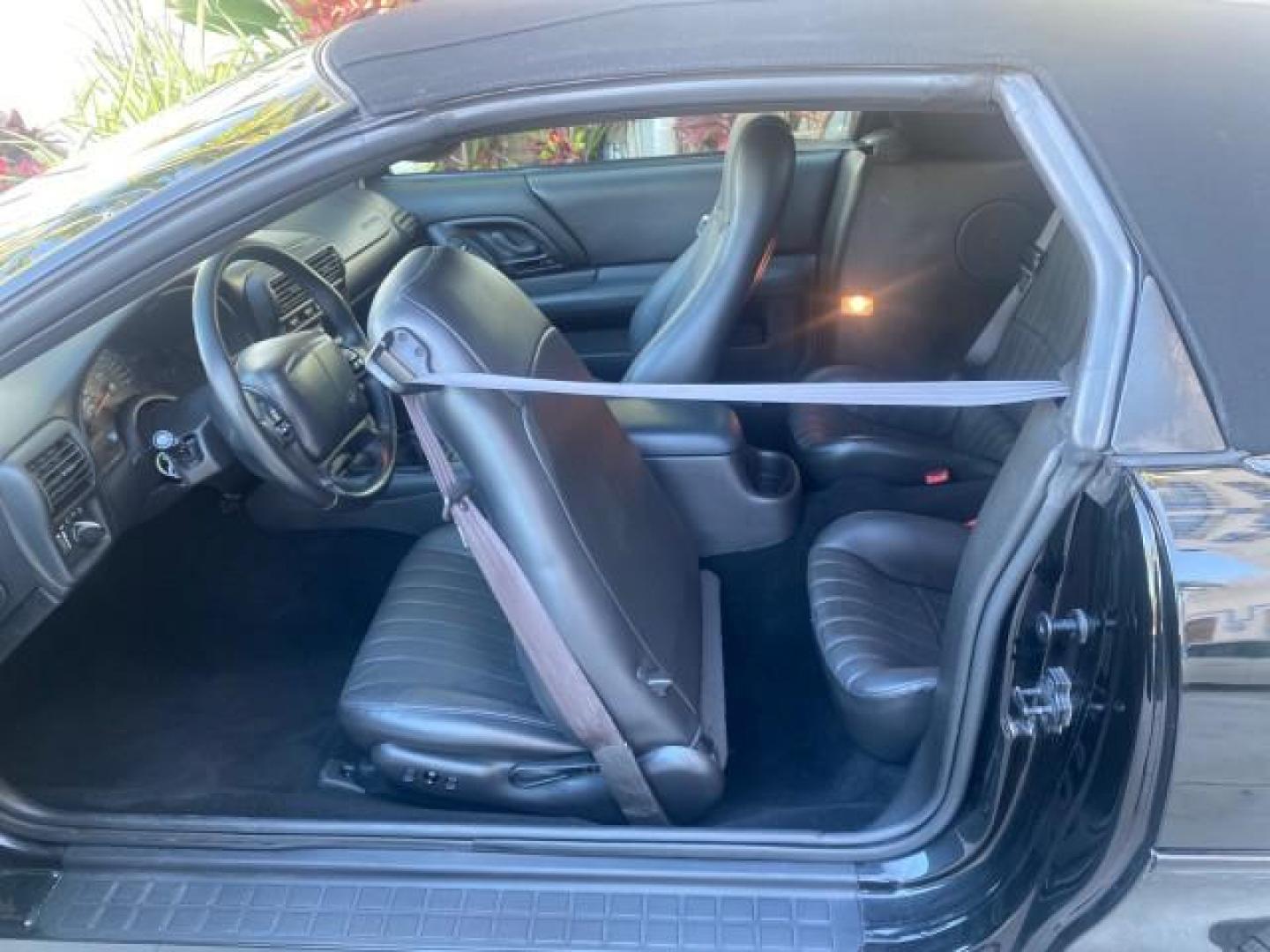 2002 Black /Ebony Chevrolet Camaro Z28 CONV 6 SPD LOW MILES 29,016 (2G1FP32G622) with an 5.7L SFI V8 Engine engine, Manual transmission, located at 4701 North Dixie Hwy, Pompano Beach, FL, 33064, (954) 422-2889, 26.240938, -80.123474 - OUR WEBPAGE FLORIDACARS1.COM HAS OVER 100 PHOTOS AND FREE CARFAX LINK 2002 CHEVROLET CAMARO Z28 6 SPEED ALL ORIGINAL PAINT VERY LOW MILES VIN: 2G1FP32G622129985 2 G 1 F P 3 2 G 6 2 2 1 2 9 9 8 5 CONVERTIBLE 5.7L V8 F OHV GASOLINE 25 MPG REAR WHEEL DRIVE Features ABS Brakes Air Conditioning Alloy Whe - Photo#90