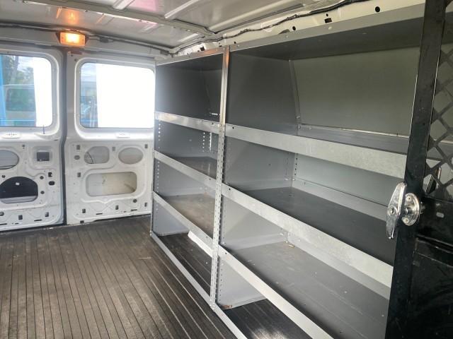2000 Oxford White /Medium Graphite Ford Econoline Cargo Van LOW MILES 68,046 (1FTRE1426YH) with an 4.2L SEFI SPI V6 Engine engine, Automatic transmission, located at 4701 North Dixie Hwy, Pompano Beach, FL, 33064, (954) 422-2889, 26.240938, -80.123474 - OUR WEBPAGE FLORIDACARS1.COM HAS OVER 100 PHOTOS AND FREE CARFAX LINK 2000 FORD E-150 CARGO VAN READY FOR WORK SAFETY DIVIDER - SHELVES- RUBBER MATS - LOOKS AND DRIVES LIKE NEW VIN: 1FTRE1426YHA31518 1 F T R E 1 4 2 6 Y H A 3 1 5 1 8 VAN 4.2L V6 F SOHC GASOLINE 19 MPG REAR WHEEL DRIVE Features ABS B - Photo#73
