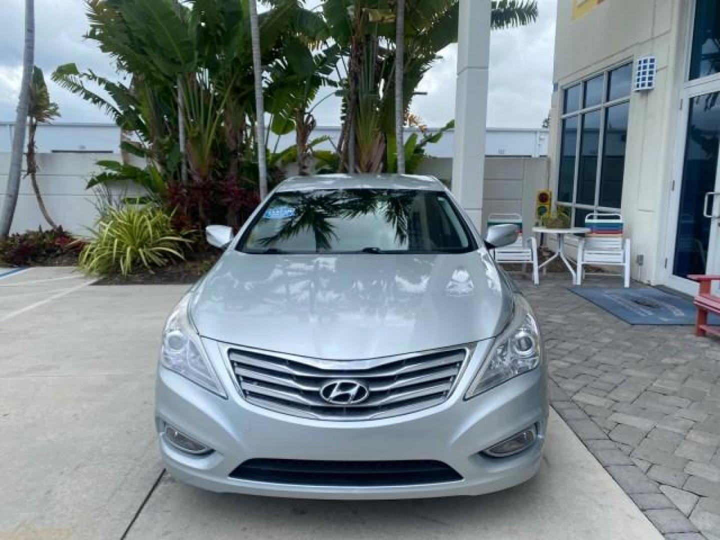 2013 Silver Frost Metallic /Graphite Black Hyundai Azera LOW MILES 12,752 LEATHER LOADED (KMHFG4JG8DA) with an 3.3L DOHC MPI 24-Valve CVVT V6 Engine engine, Automatic transmission, located at 4701 North Dixie Hwy, Pompano Beach, FL, 33064, (954) 422-2889, 26.240938, -80.123474 - OUR WEBPAGE FLORIDACARS1.COM HAS OVER 100 PHOTOS AND FREE CARFAX LINK 2013 HYUNDAI AZERA ONLY 12,752 MILES 1 OF A KIND FIND - $ ORIGINAL PRICE $32,360 VIN: KMHFG4JG8DA228283 K M H F G 4 J G 8 D A 2 2 8 2 8 3 SEDAN 4 DR 3.3L V6 F DOHC 24V GASOLINE 29 MPG FRONT WHEEL DRIVE Features ABS Brakes Air Cond - Photo#2