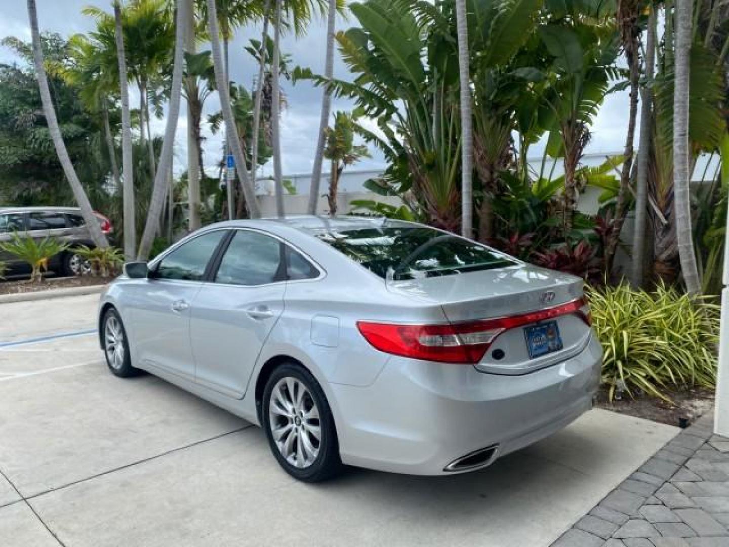 2013 Silver Frost Metallic /Graphite Black Hyundai Azera LOW MILES 12,752 LEATHER LOADED (KMHFG4JG8DA) with an 3.3L DOHC MPI 24-Valve CVVT V6 Engine engine, Automatic transmission, located at 4701 North Dixie Hwy, Pompano Beach, FL, 33064, (954) 422-2889, 26.240938, -80.123474 - OUR WEBPAGE FLORIDACARS1.COM HAS OVER 100 PHOTOS AND FREE CARFAX LINK 2013 HYUNDAI AZERA ONLY 12,752 MILES 1 OF A KIND FIND - $ ORIGINAL PRICE $32,360 VIN: KMHFG4JG8DA228283 K M H F G 4 J G 8 D A 2 2 8 2 8 3 SEDAN 4 DR 3.3L V6 F DOHC 24V GASOLINE 29 MPG FRONT WHEEL DRIVE Features ABS Brakes Air Cond - Photo#5
