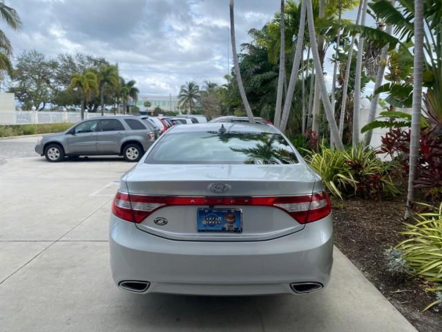 2013 Silver Frost Metallic /Graphite Black Hyundai Azera LOW MILES 12,752 LEATHER LOADED (KMHFG4JG8DA) with an 3.3L DOHC MPI 24-Valve CVVT V6 Engine engine, Automatic transmission, located at 4701 North Dixie Hwy, Pompano Beach, FL, 33064, (954) 422-2889, 26.240938, -80.123474 - OUR WEBPAGE FLORIDACARS1.COM HAS OVER 100 PHOTOS AND FREE CARFAX LINK 2013 HYUNDAI AZERA ONLY 12,752 MILES 1 OF A KIND FIND - $ ORIGINAL PRICE $32,360 VIN: KMHFG4JG8DA228283 K M H F G 4 J G 8 D A 2 2 8 2 8 3 SEDAN 4 DR 3.3L V6 F DOHC 24V GASOLINE 29 MPG FRONT WHEEL DRIVE Features ABS Brakes Air Cond - Photo#6