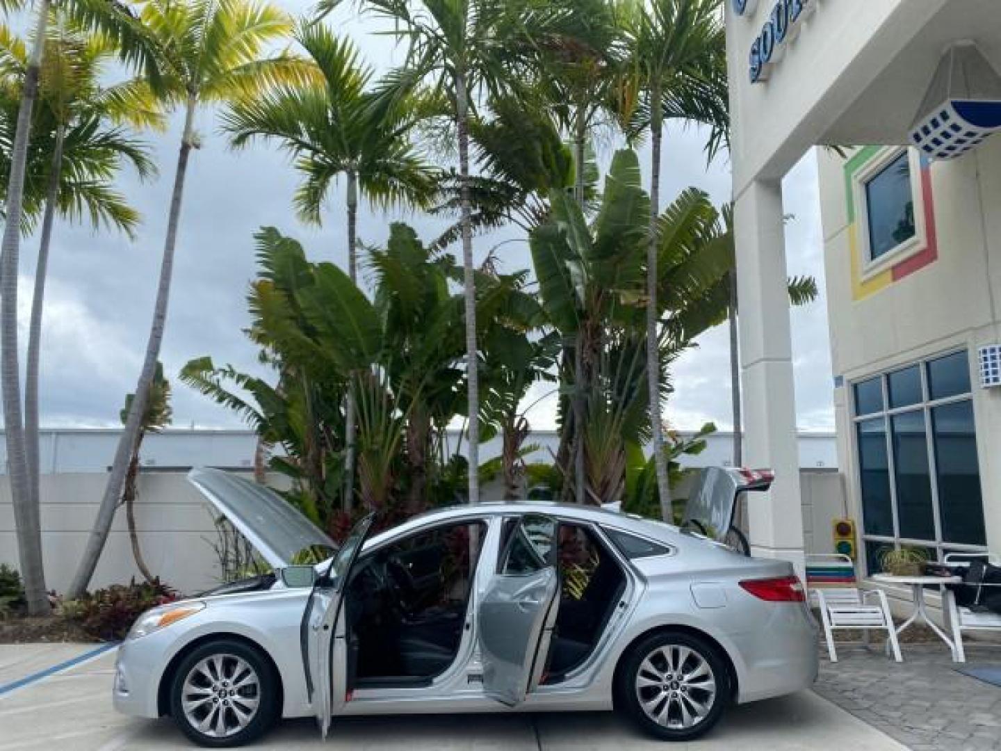 2013 Silver Frost Metallic /Graphite Black Hyundai Azera LOW MILES 12,752 LEATHER LOADED (KMHFG4JG8DA) with an 3.3L DOHC MPI 24-Valve CVVT V6 Engine engine, Automatic transmission, located at 4701 North Dixie Hwy, Pompano Beach, FL, 33064, (954) 422-2889, 26.240938, -80.123474 - OUR WEBPAGE FLORIDACARS1.COM HAS OVER 100 PHOTOS AND FREE CARFAX LINK 2013 HYUNDAI AZERA ONLY 12,752 MILES 1 OF A KIND FIND - $ ORIGINAL PRICE $32,360 VIN: KMHFG4JG8DA228283 K M H F G 4 J G 8 D A 2 2 8 2 8 3 SEDAN 4 DR 3.3L V6 F DOHC 24V GASOLINE 29 MPG FRONT WHEEL DRIVE Features ABS Brakes Air Cond - Photo#8