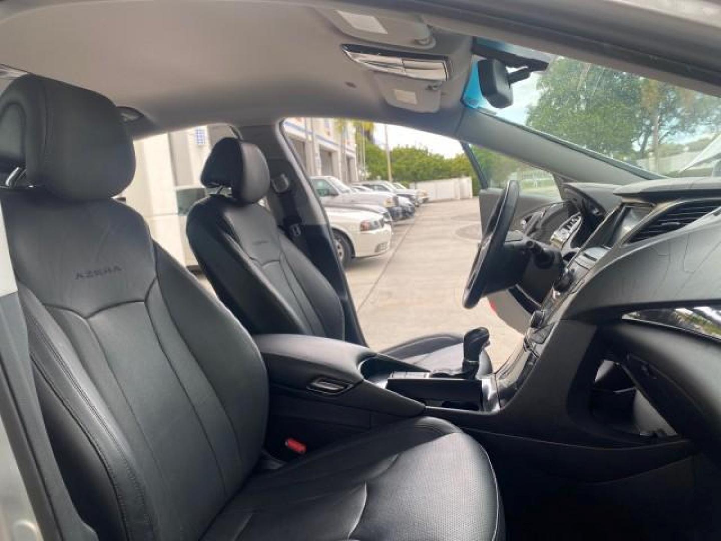 2013 Silver Frost Metallic /Graphite Black Hyundai Azera LOW MILES 12,752 LEATHER LOADED (KMHFG4JG8DA) with an 3.3L DOHC MPI 24-Valve CVVT V6 Engine engine, Automatic transmission, located at 4701 North Dixie Hwy, Pompano Beach, FL, 33064, (954) 422-2889, 26.240938, -80.123474 - OUR WEBPAGE FLORIDACARS1.COM HAS OVER 100 PHOTOS AND FREE CARFAX LINK 2013 HYUNDAI AZERA ONLY 12,752 MILES 1 OF A KIND FIND - $ ORIGINAL PRICE $32,360 VIN: KMHFG4JG8DA228283 K M H F G 4 J G 8 D A 2 2 8 2 8 3 SEDAN 4 DR 3.3L V6 F DOHC 24V GASOLINE 29 MPG FRONT WHEEL DRIVE Features ABS Brakes Air Cond - Photo#12