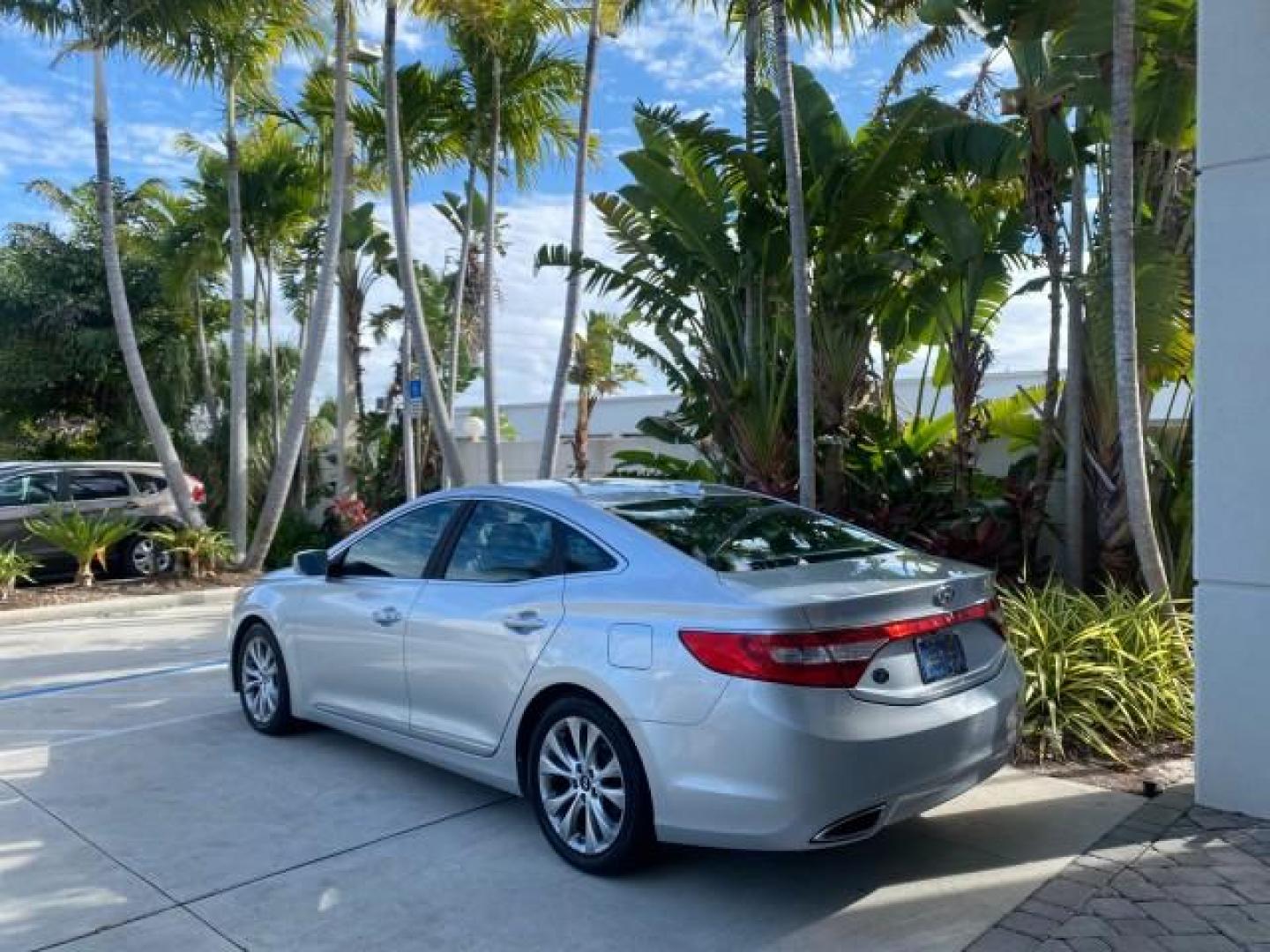 2013 Silver Frost Metallic /Graphite Black Hyundai Azera LOW MILES 12,752 LEATHER LOADED (KMHFG4JG8DA) with an 3.3L DOHC MPI 24-Valve CVVT V6 Engine engine, Automatic transmission, located at 4701 North Dixie Hwy, Pompano Beach, FL, 33064, (954) 422-2889, 26.240938, -80.123474 - OUR WEBPAGE FLORIDACARS1.COM HAS OVER 100 PHOTOS AND FREE CARFAX LINK 2013 HYUNDAI AZERA ONLY 12,752 MILES 1 OF A KIND FIND - $ ORIGINAL PRICE $32,360 VIN: KMHFG4JG8DA228283 K M H F G 4 J G 8 D A 2 2 8 2 8 3 SEDAN 4 DR 3.3L V6 F DOHC 24V GASOLINE 29 MPG FRONT WHEEL DRIVE Features ABS Brakes Air Cond - Photo#32