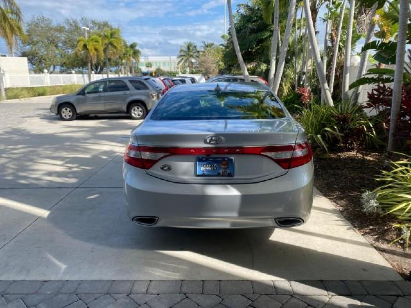 2013 Silver Frost Metallic /Graphite Black Hyundai Azera LOW MILES 12,752 LEATHER LOADED (KMHFG4JG8DA) with an 3.3L DOHC MPI 24-Valve CVVT V6 Engine engine, Automatic transmission, located at 4701 North Dixie Hwy, Pompano Beach, FL, 33064, (954) 422-2889, 26.240938, -80.123474 - OUR WEBPAGE FLORIDACARS1.COM HAS OVER 100 PHOTOS AND FREE CARFAX LINK 2013 HYUNDAI AZERA ONLY 12,752 MILES 1 OF A KIND FIND - $ ORIGINAL PRICE $32,360 VIN: KMHFG4JG8DA228283 K M H F G 4 J G 8 D A 2 2 8 2 8 3 SEDAN 4 DR 3.3L V6 F DOHC 24V GASOLINE 29 MPG FRONT WHEEL DRIVE Features ABS Brakes Air Cond - Photo#34
