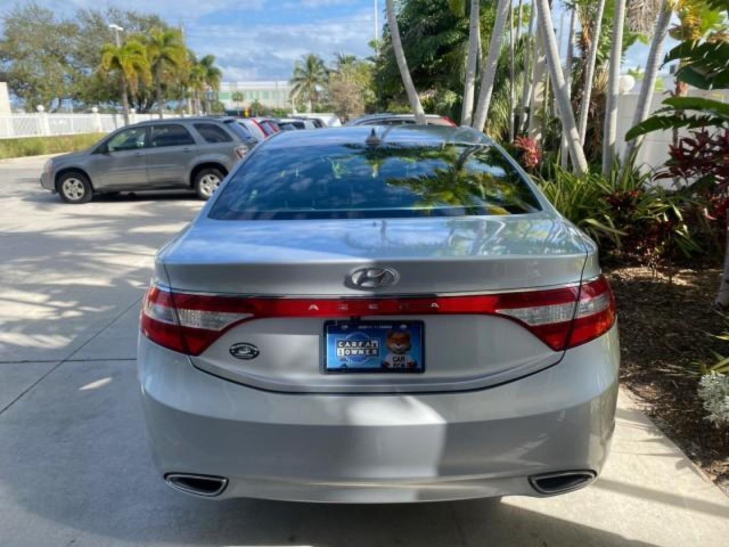 2013 Silver Frost Metallic /Graphite Black Hyundai Azera LOW MILES 12,752 LEATHER LOADED (KMHFG4JG8DA) with an 3.3L DOHC MPI 24-Valve CVVT V6 Engine engine, Automatic transmission, located at 4701 North Dixie Hwy, Pompano Beach, FL, 33064, (954) 422-2889, 26.240938, -80.123474 - OUR WEBPAGE FLORIDACARS1.COM HAS OVER 100 PHOTOS AND FREE CARFAX LINK 2013 HYUNDAI AZERA ONLY 12,752 MILES 1 OF A KIND FIND - $ ORIGINAL PRICE $32,360 VIN: KMHFG4JG8DA228283 K M H F G 4 J G 8 D A 2 2 8 2 8 3 SEDAN 4 DR 3.3L V6 F DOHC 24V GASOLINE 29 MPG FRONT WHEEL DRIVE Features ABS Brakes Air Cond - Photo#35