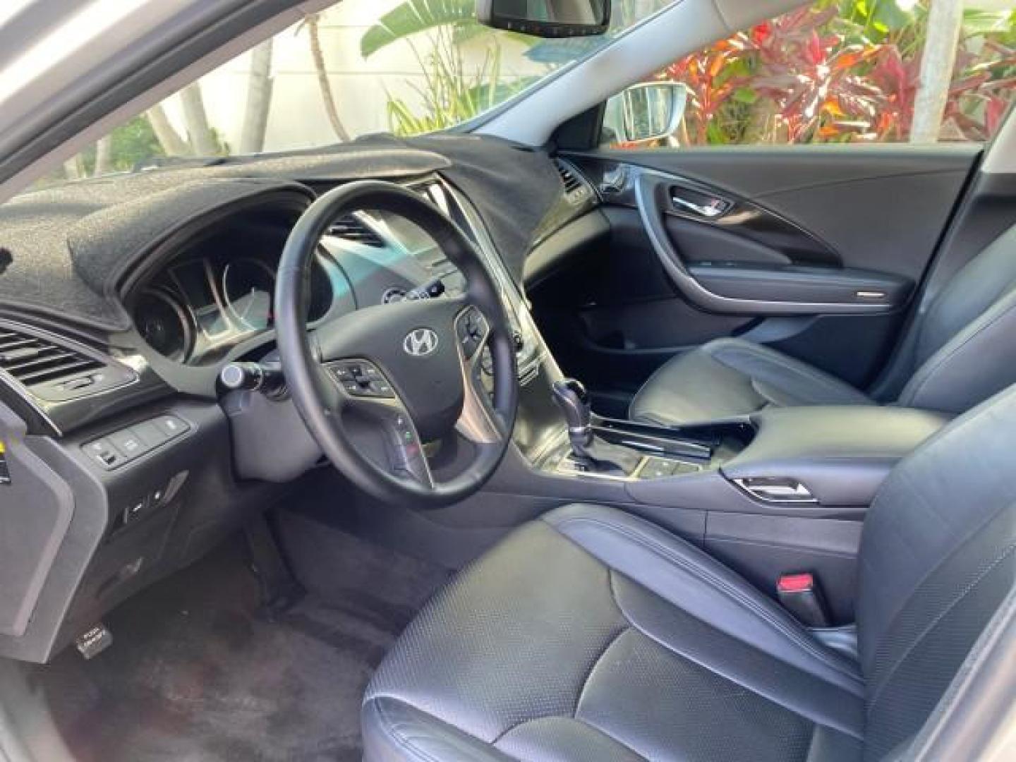 2013 Silver Frost Metallic /Graphite Black Hyundai Azera LOW MILES 12,752 LEATHER LOADED (KMHFG4JG8DA) with an 3.3L DOHC MPI 24-Valve CVVT V6 Engine engine, Automatic transmission, located at 4701 North Dixie Hwy, Pompano Beach, FL, 33064, (954) 422-2889, 26.240938, -80.123474 - OUR WEBPAGE FLORIDACARS1.COM HAS OVER 100 PHOTOS AND FREE CARFAX LINK 2013 HYUNDAI AZERA ONLY 12,752 MILES 1 OF A KIND FIND - $ ORIGINAL PRICE $32,360 VIN: KMHFG4JG8DA228283 K M H F G 4 J G 8 D A 2 2 8 2 8 3 SEDAN 4 DR 3.3L V6 F DOHC 24V GASOLINE 29 MPG FRONT WHEEL DRIVE Features ABS Brakes Air Cond - Photo#44