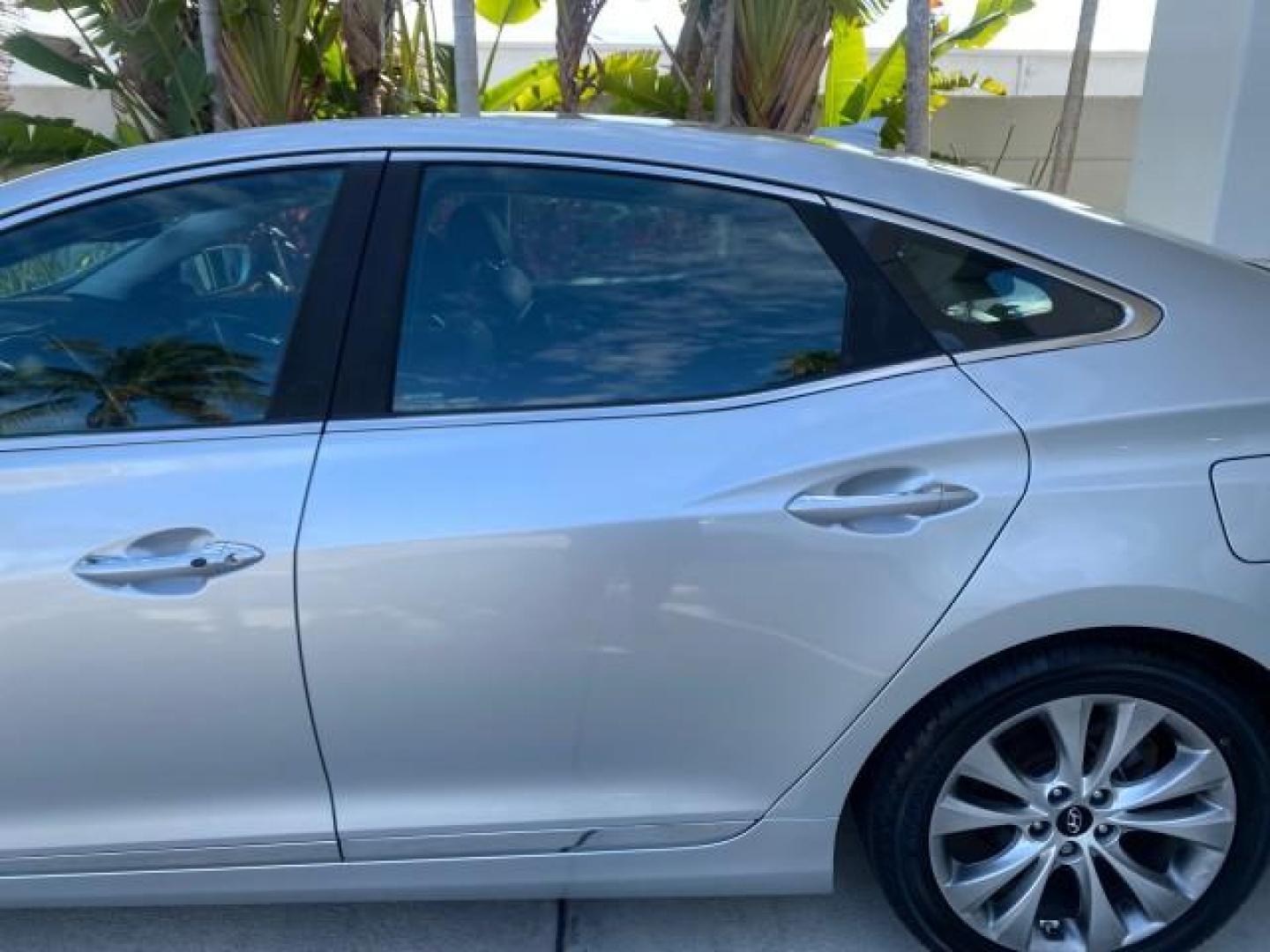 2013 Silver Frost Metallic /Graphite Black Hyundai Azera LOW MILES 12,752 LEATHER LOADED (KMHFG4JG8DA) with an 3.3L DOHC MPI 24-Valve CVVT V6 Engine engine, Automatic transmission, located at 4701 North Dixie Hwy, Pompano Beach, FL, 33064, (954) 422-2889, 26.240938, -80.123474 - OUR WEBPAGE FLORIDACARS1.COM HAS OVER 100 PHOTOS AND FREE CARFAX LINK 2013 HYUNDAI AZERA ONLY 12,752 MILES 1 OF A KIND FIND - $ ORIGINAL PRICE $32,360 VIN: KMHFG4JG8DA228283 K M H F G 4 J G 8 D A 2 2 8 2 8 3 SEDAN 4 DR 3.3L V6 F DOHC 24V GASOLINE 29 MPG FRONT WHEEL DRIVE Features ABS Brakes Air Cond - Photo#75