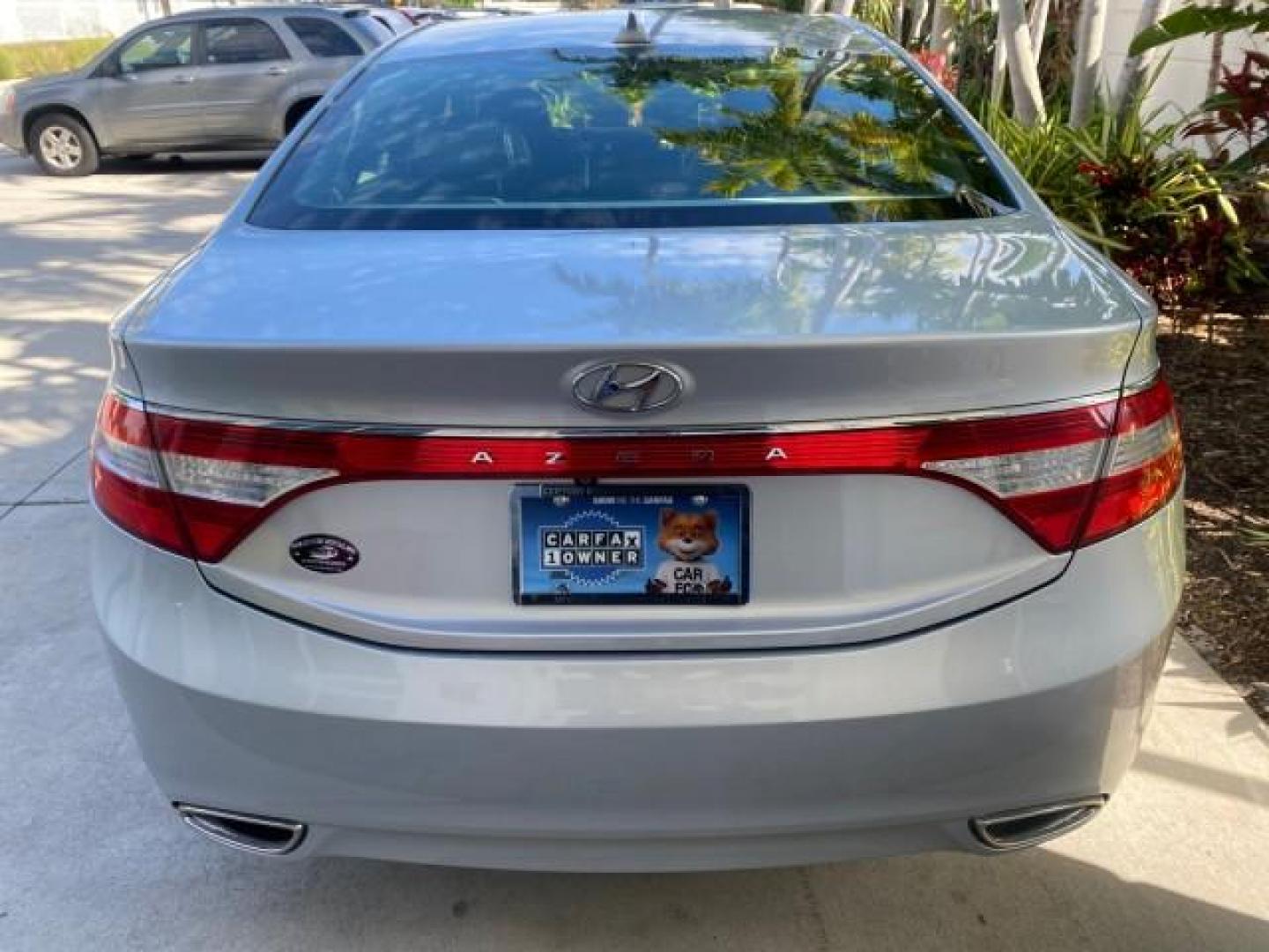 2013 Silver Frost Metallic /Graphite Black Hyundai Azera LOW MILES 12,752 LEATHER LOADED (KMHFG4JG8DA) with an 3.3L DOHC MPI 24-Valve CVVT V6 Engine engine, Automatic transmission, located at 4701 North Dixie Hwy, Pompano Beach, FL, 33064, (954) 422-2889, 26.240938, -80.123474 - OUR WEBPAGE FLORIDACARS1.COM HAS OVER 100 PHOTOS AND FREE CARFAX LINK 2013 HYUNDAI AZERA ONLY 12,752 MILES 1 OF A KIND FIND - $ ORIGINAL PRICE $32,360 VIN: KMHFG4JG8DA228283 K M H F G 4 J G 8 D A 2 2 8 2 8 3 SEDAN 4 DR 3.3L V6 F DOHC 24V GASOLINE 29 MPG FRONT WHEEL DRIVE Features ABS Brakes Air Cond - Photo#94