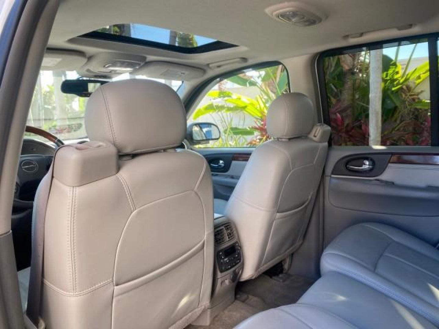 2006 Summit White /Light Gray GMC Envoy Denali LOW MILES 49,532 4WD SUNROOF (1GKET63M862) with an 5.3L Vortec 5300 V8 SFI Engine engine, Automatic transmission, located at 4701 North Dixie Hwy, Pompano Beach, FL, 33064, (954) 422-2889, 26.240938, -80.123474 - OUR WEBPAGE FLORIDACARS1.COM HAS OVER 100 PHOTOS AND FREE CARFAX LINK 2006 GMC ENVOY DENALI 4WD LEATHER LOADED SUNROOF ORIGINAL PRICE $38,600 VIN: 1GKET63M862217425 1 G K E T 6 3 M 8 6 2 2 1 7 4 2 5 4 DOOR WAGON/SPORT UTILITY 5.3L V8 F GASOLINE 21 MPG REAR WHEEL DRIVE W/ 4X4 Features 4WD/AWD ABS Bra - Photo#80
