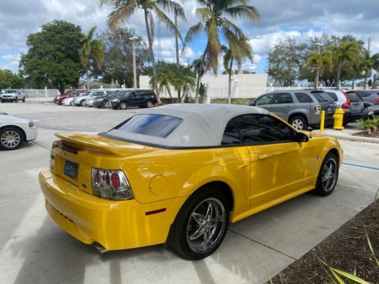 1999 Chrome Yellow /Oxford White Ford Mustang GT LOW MILES 8,145 1 OWNER FL CONV (1FAFP45X3XF) with an 4.6L SOHC SMPI V8 Engine engine, Automatic transmission, located at 4701 North Dixie Hwy, Pompano Beach, FL, 33064, (954) 422-2889, 26.240938, -80.123474 - OUR WEBPAGE FLORIDACARS1.COM HAS OVER 100 PHOTOS AND FREE CARFAX LINK 1999 FORD MUSTANG GT 1 OWNER VIN: 1FAFP45X3XF127745 1 F A F P 4 5 X 3 X F 1 2 7 7 4 5 CONVERTIBLE 4.6L V8 F SOHC 16V GASOLINE 24 MPG REAR WHEEL DRIVE Features ABS Brakes Air Conditioning Alloy Wheels AM/FM Stereo Automatic Transmi - Photo#7