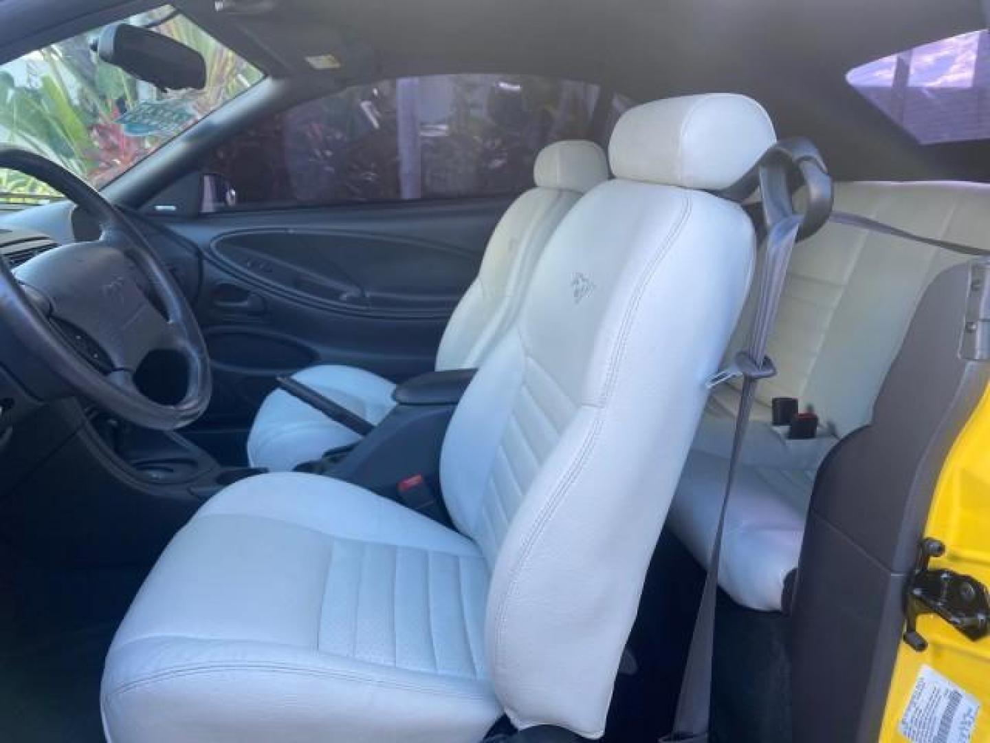 1999 Chrome Yellow /Oxford White Ford Mustang GT LOW MILES 8,145 1 OWNER FL CONV (1FAFP45X3XF) with an 4.6L SOHC SMPI V8 Engine engine, Automatic transmission, located at 4701 North Dixie Hwy, Pompano Beach, FL, 33064, (954) 422-2889, 26.240938, -80.123474 - OUR WEBPAGE FLORIDACARS1.COM HAS OVER 100 PHOTOS AND FREE CARFAX LINK 1999 FORD MUSTANG GT 1 OWNER VIN: 1FAFP45X3XF127745 1 F A F P 4 5 X 3 X F 1 2 7 7 4 5 CONVERTIBLE 4.6L V8 F SOHC 16V GASOLINE 24 MPG REAR WHEEL DRIVE Features ABS Brakes Air Conditioning Alloy Wheels AM/FM Stereo Automatic Transmi - Photo#10