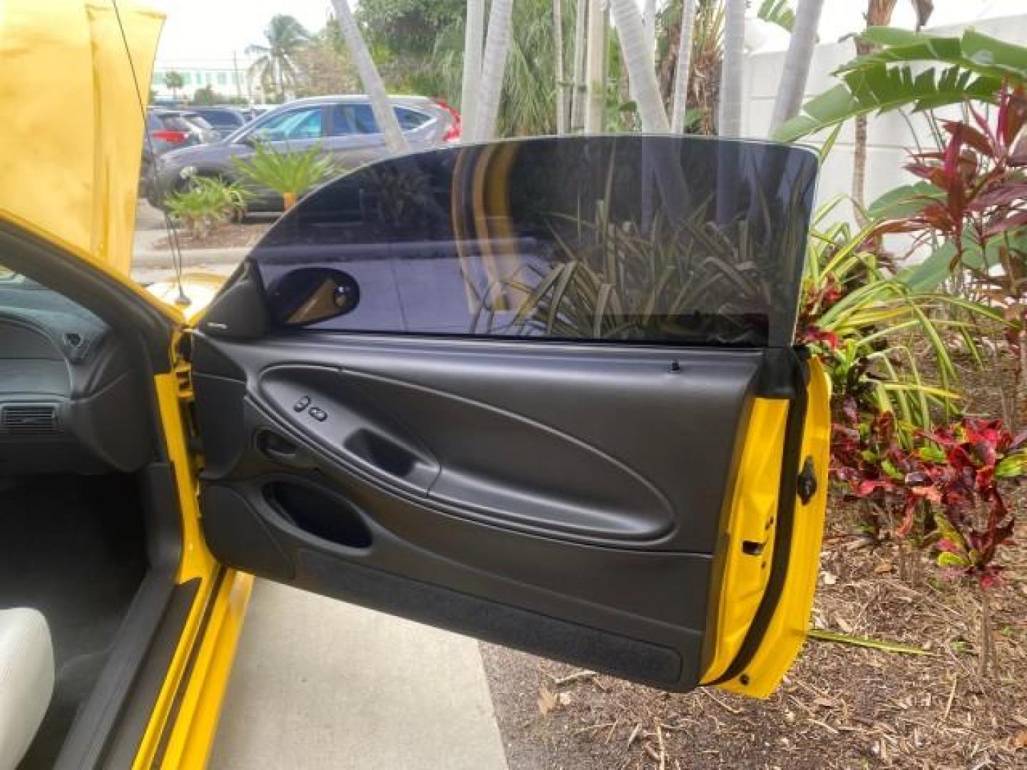 1999 Chrome Yellow /Oxford White Ford Mustang GT LOW MILES 8,145 1 OWNER FL CONV (1FAFP45X3XF) with an 4.6L SOHC SMPI V8 Engine engine, Automatic transmission, located at 4701 North Dixie Hwy, Pompano Beach, FL, 33064, (954) 422-2889, 26.240938, -80.123474 - OUR WEBPAGE FLORIDACARS1.COM HAS OVER 100 PHOTOS AND FREE CARFAX LINK 1999 FORD MUSTANG GT 1 OWNER VIN: 1FAFP45X3XF127745 1 F A F P 4 5 X 3 X F 1 2 7 7 4 5 CONVERTIBLE 4.6L V8 F SOHC 16V GASOLINE 24 MPG REAR WHEEL DRIVE Features ABS Brakes Air Conditioning Alloy Wheels AM/FM Stereo Automatic Transmi - Photo#11