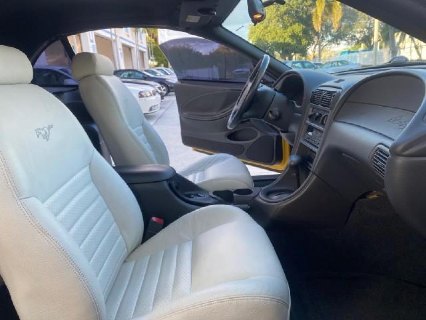 1999 Chrome Yellow /Oxford White Ford Mustang GT LOW MILES 8,145 1 OWNER FL CONV (1FAFP45X3XF) with an 4.6L SOHC SMPI V8 Engine engine, Automatic transmission, located at 4701 North Dixie Hwy, Pompano Beach, FL, 33064, (954) 422-2889, 26.240938, -80.123474 - OUR WEBPAGE FLORIDACARS1.COM HAS OVER 100 PHOTOS AND FREE CARFAX LINK 1999 FORD MUSTANG GT 1 OWNER VIN: 1FAFP45X3XF127745 1 F A F P 4 5 X 3 X F 1 2 7 7 4 5 CONVERTIBLE 4.6L V8 F SOHC 16V GASOLINE 24 MPG REAR WHEEL DRIVE Features ABS Brakes Air Conditioning Alloy Wheels AM/FM Stereo Automatic Transmi - Photo#12