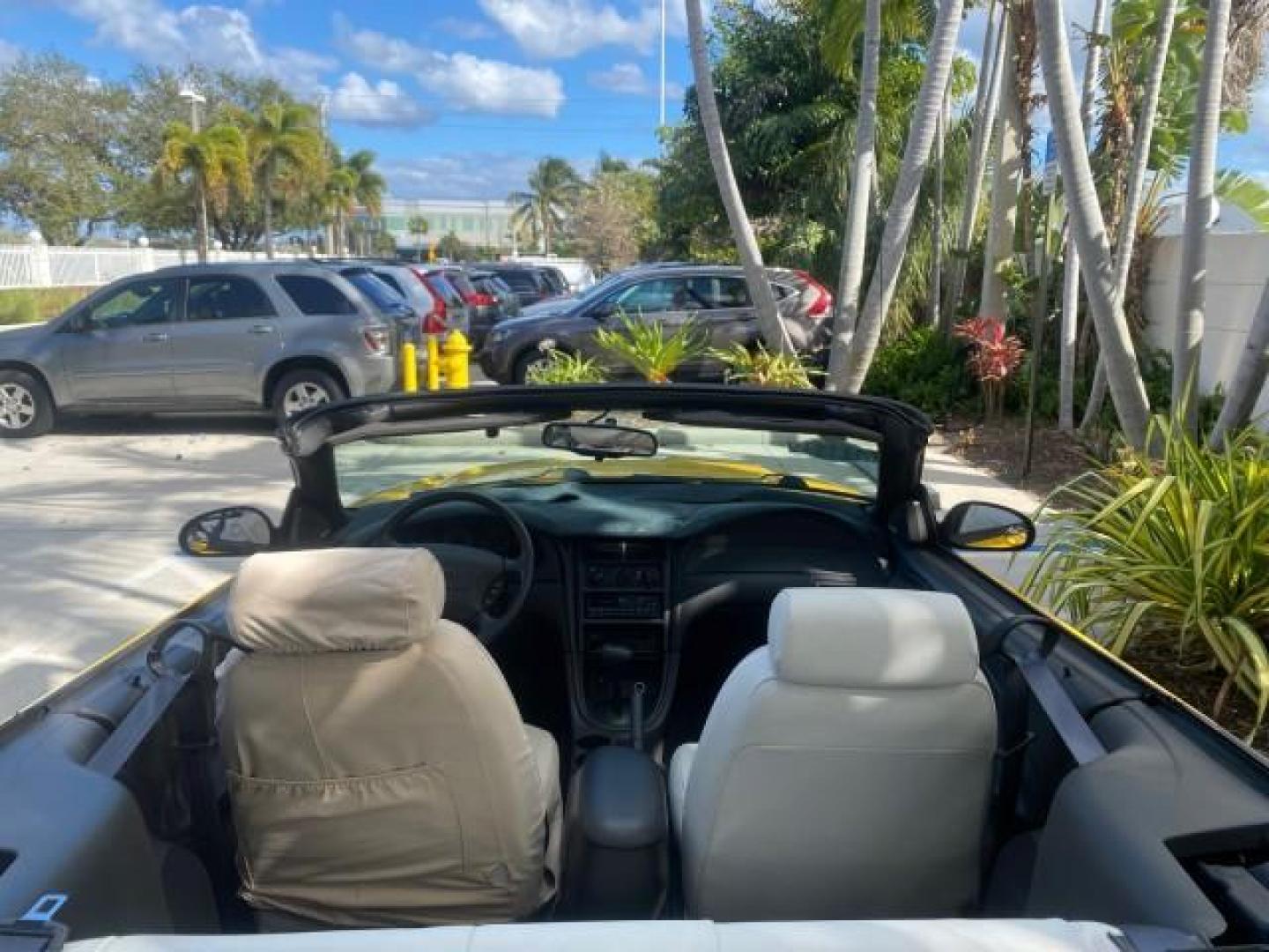 1999 Chrome Yellow /Oxford White Ford Mustang GT LOW MILES 8,145 1 OWNER FL CONV (1FAFP45X3XF) with an 4.6L SOHC SMPI V8 Engine engine, Automatic transmission, located at 4701 North Dixie Hwy, Pompano Beach, FL, 33064, (954) 422-2889, 26.240938, -80.123474 - OUR WEBPAGE FLORIDACARS1.COM HAS OVER 100 PHOTOS AND FREE CARFAX LINK 1999 FORD MUSTANG GT 1 OWNER VIN: 1FAFP45X3XF127745 1 F A F P 4 5 X 3 X F 1 2 7 7 4 5 CONVERTIBLE 4.6L V8 F SOHC 16V GASOLINE 24 MPG REAR WHEEL DRIVE Features ABS Brakes Air Conditioning Alloy Wheels AM/FM Stereo Automatic Transmi - Photo#46