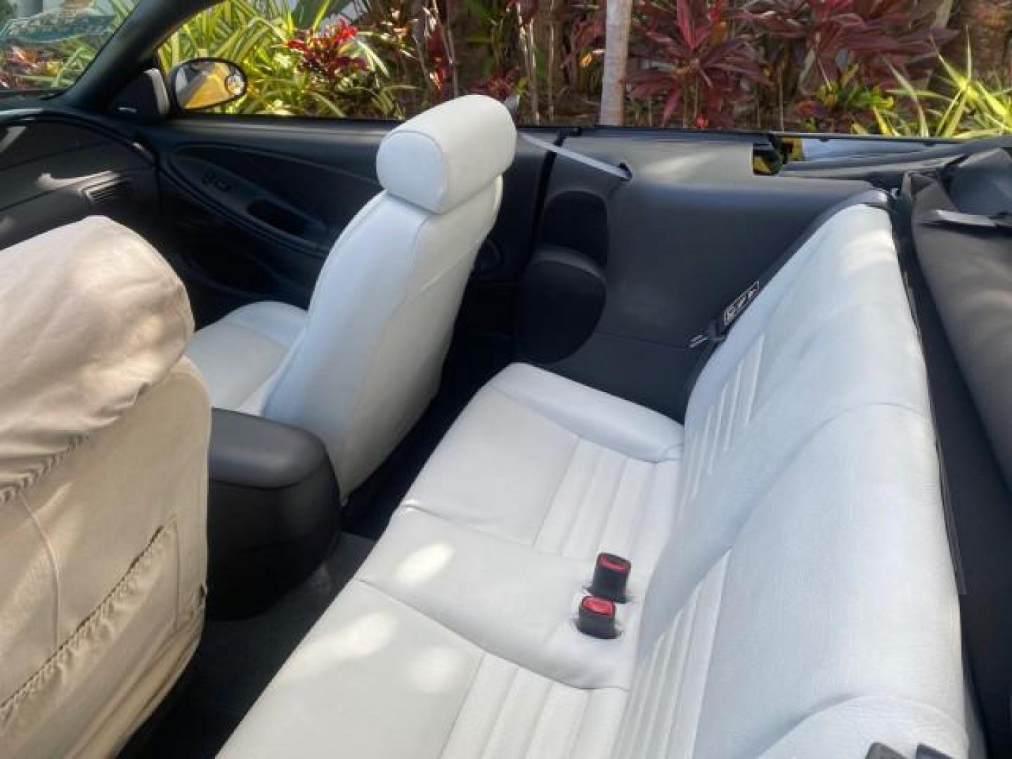 1999 Chrome Yellow /Oxford White Ford Mustang GT LOW MILES 8,145 1 OWNER FL CONV (1FAFP45X3XF) with an 4.6L SOHC SMPI V8 Engine engine, Automatic transmission, located at 4701 North Dixie Hwy, Pompano Beach, FL, 33064, (954) 422-2889, 26.240938, -80.123474 - OUR WEBPAGE FLORIDACARS1.COM HAS OVER 100 PHOTOS AND FREE CARFAX LINK 1999 FORD MUSTANG GT 1 OWNER VIN: 1FAFP45X3XF127745 1 F A F P 4 5 X 3 X F 1 2 7 7 4 5 CONVERTIBLE 4.6L V8 F SOHC 16V GASOLINE 24 MPG REAR WHEEL DRIVE Features ABS Brakes Air Conditioning Alloy Wheels AM/FM Stereo Automatic Transmi - Photo#48