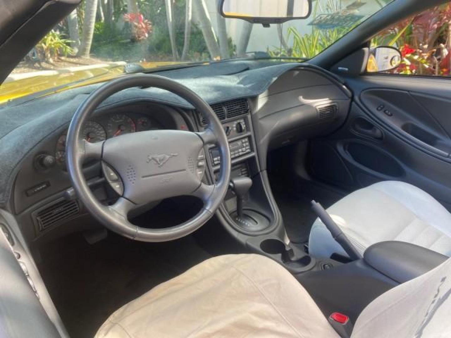1999 Chrome Yellow /Oxford White Ford Mustang GT LOW MILES 8,145 1 OWNER FL CONV (1FAFP45X3XF) with an 4.6L SOHC SMPI V8 Engine engine, Automatic transmission, located at 4701 North Dixie Hwy, Pompano Beach, FL, 33064, (954) 422-2889, 26.240938, -80.123474 - OUR WEBPAGE FLORIDACARS1.COM HAS OVER 100 PHOTOS AND FREE CARFAX LINK 1999 FORD MUSTANG GT 1 OWNER VIN: 1FAFP45X3XF127745 1 F A F P 4 5 X 3 X F 1 2 7 7 4 5 CONVERTIBLE 4.6L V8 F SOHC 16V GASOLINE 24 MPG REAR WHEEL DRIVE Features ABS Brakes Air Conditioning Alloy Wheels AM/FM Stereo Automatic Transmi - Photo#49