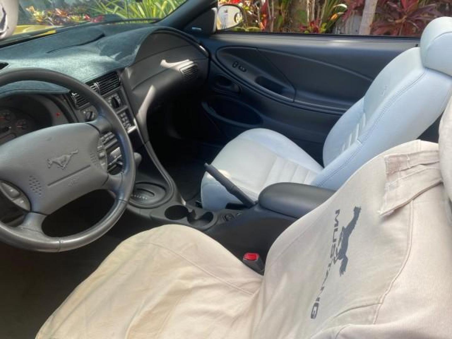 1999 Chrome Yellow /Oxford White Ford Mustang GT LOW MILES 8,145 1 OWNER FL CONV (1FAFP45X3XF) with an 4.6L SOHC SMPI V8 Engine engine, Automatic transmission, located at 4701 North Dixie Hwy, Pompano Beach, FL, 33064, (954) 422-2889, 26.240938, -80.123474 - OUR WEBPAGE FLORIDACARS1.COM HAS OVER 100 PHOTOS AND FREE CARFAX LINK 1999 FORD MUSTANG GT 1 OWNER VIN: 1FAFP45X3XF127745 1 F A F P 4 5 X 3 X F 1 2 7 7 4 5 CONVERTIBLE 4.6L V8 F SOHC 16V GASOLINE 24 MPG REAR WHEEL DRIVE Features ABS Brakes Air Conditioning Alloy Wheels AM/FM Stereo Automatic Transmi - Photo#50